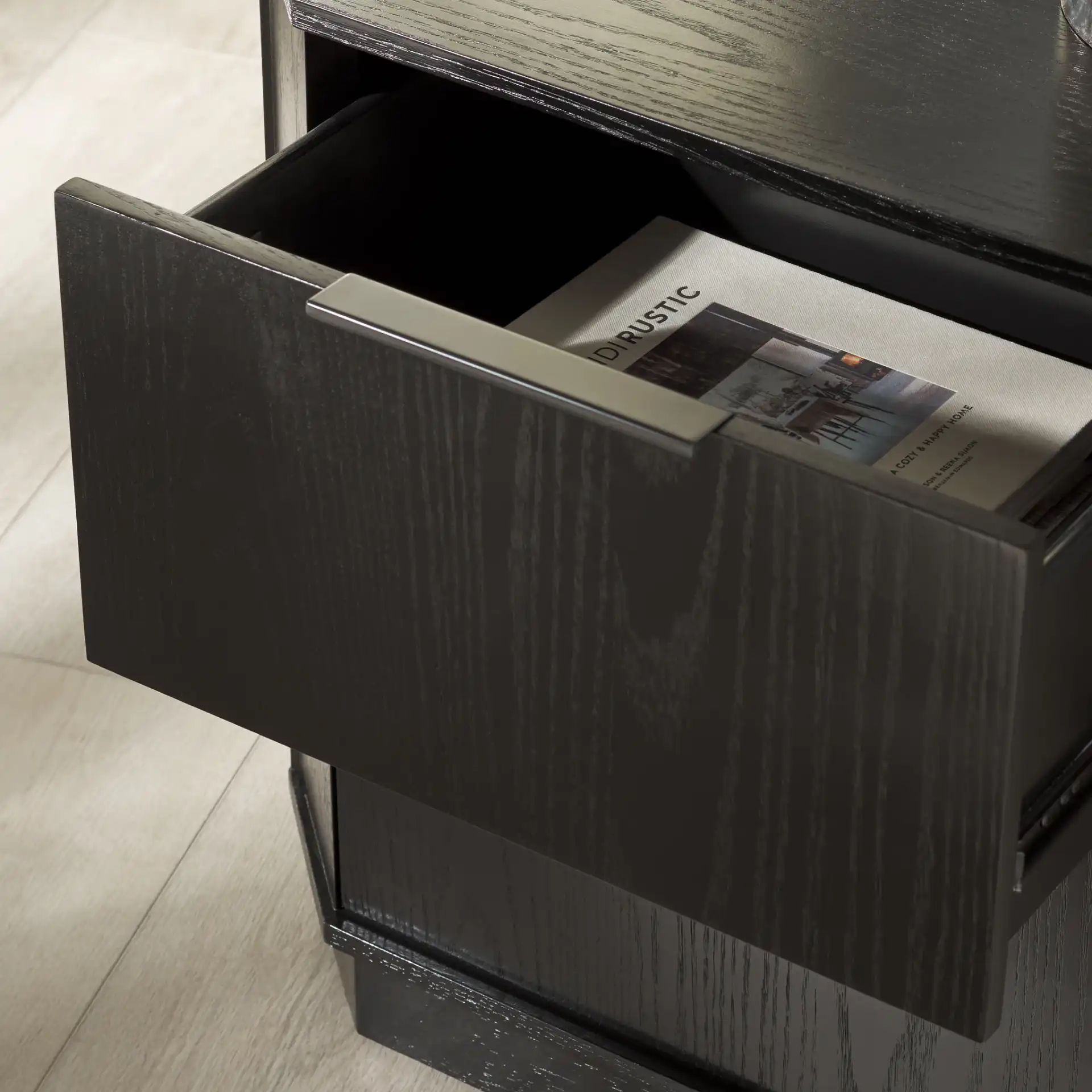 Aerilyn Two-Drawer Nightstand in Black in a styled room