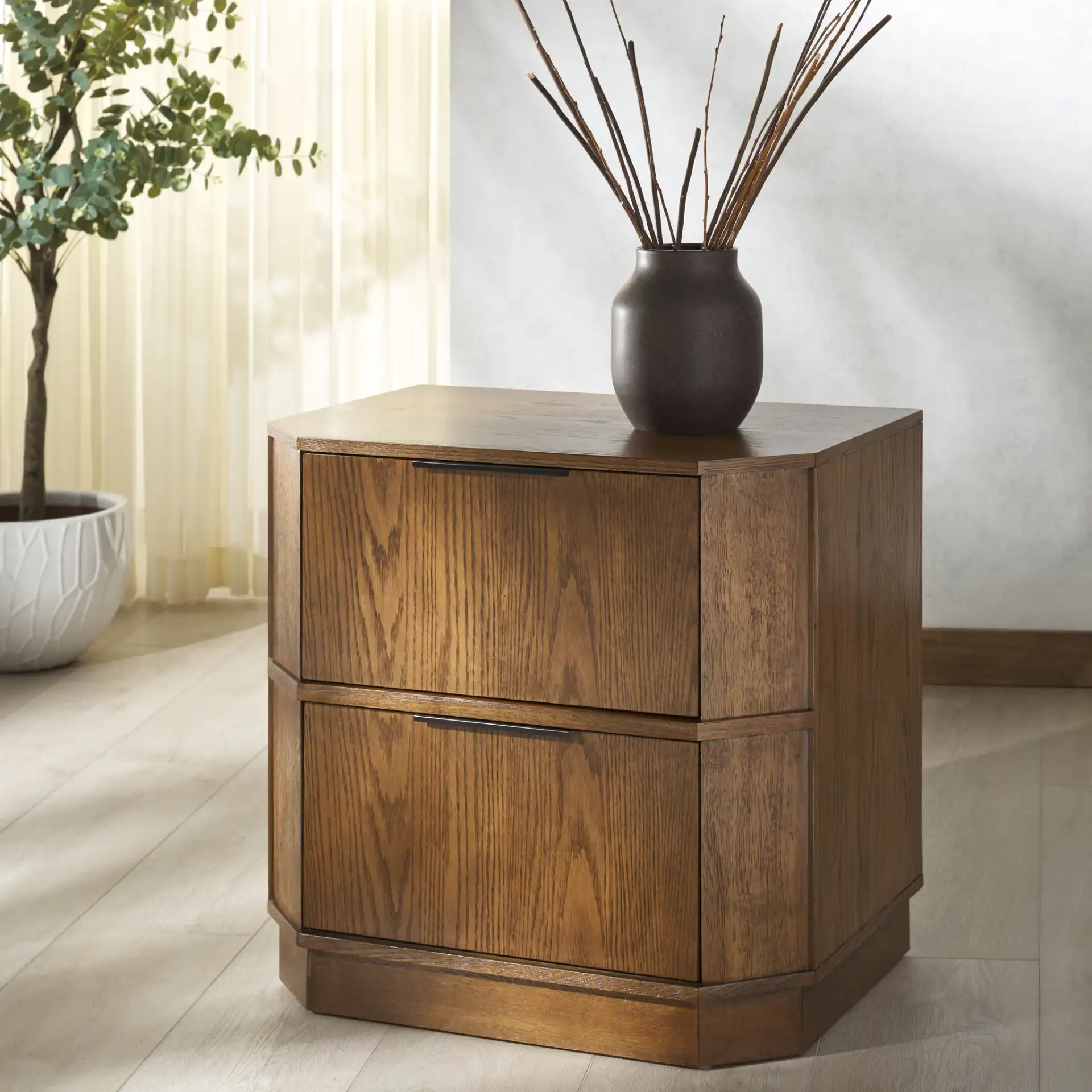 Aerilyn Two-Drawer Nightstand in Medium Oak in a styled room