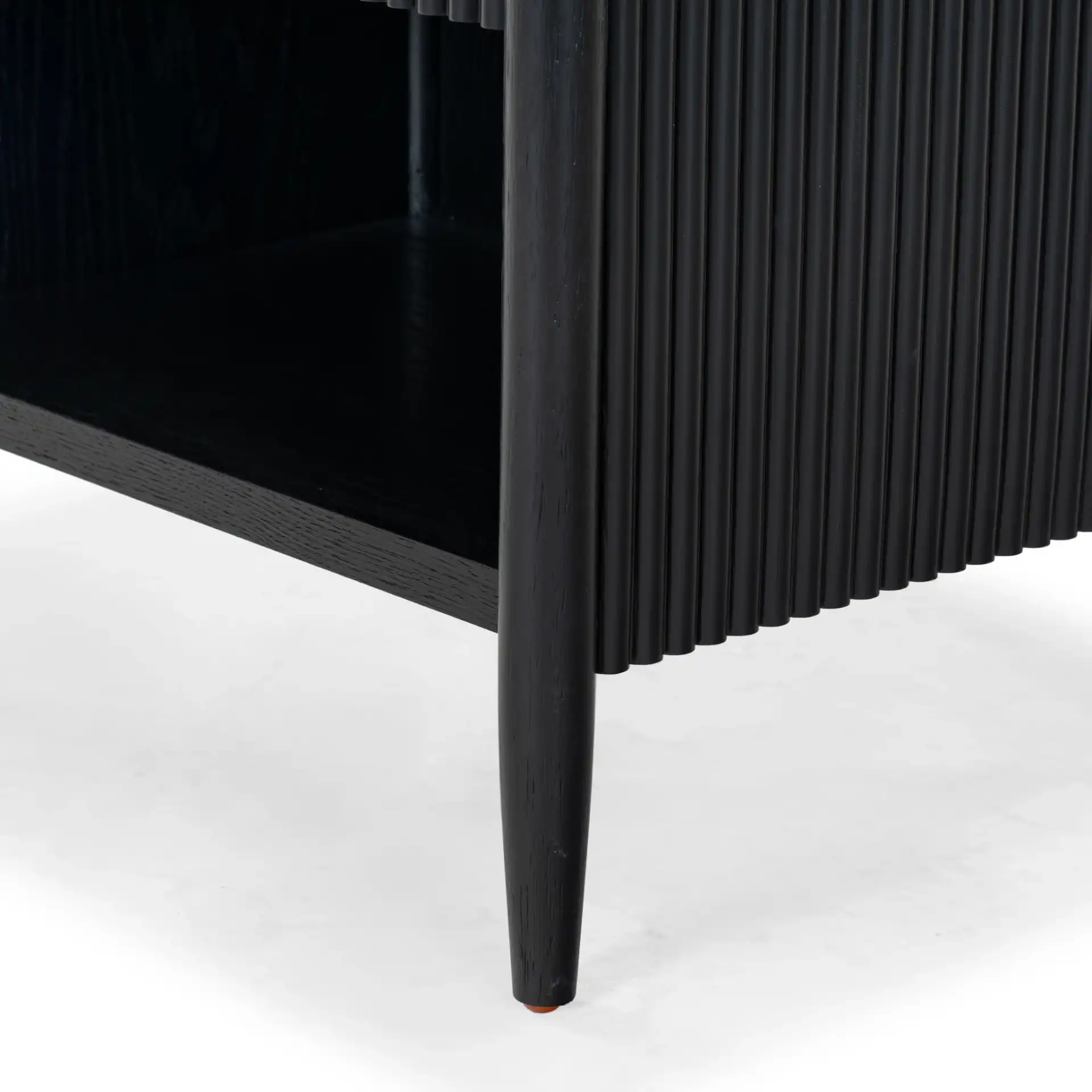 Shelbie One-Drawer Nightstand in Black in a styled room