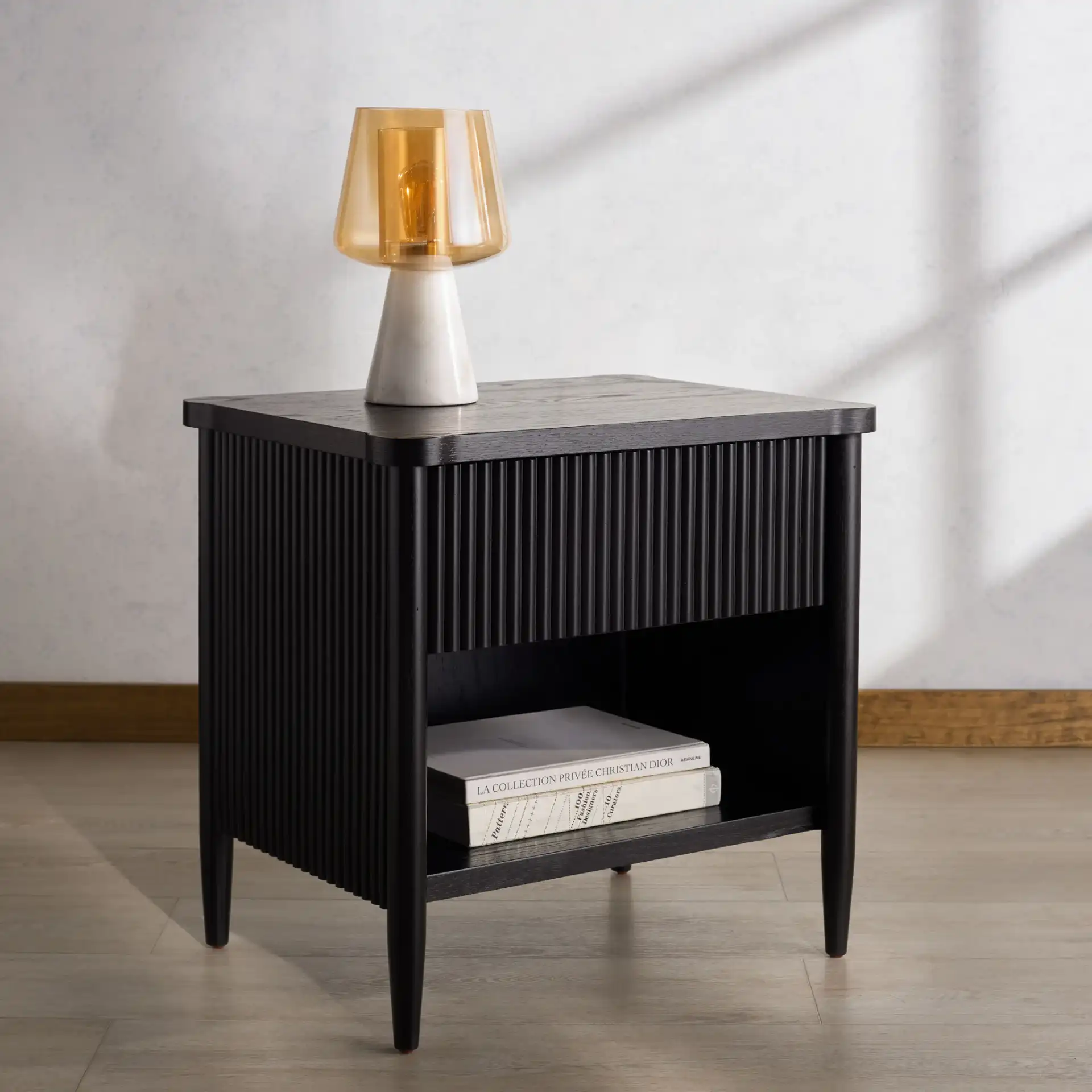 Shelbie One-Drawer Nightstand in Black in a styled room
