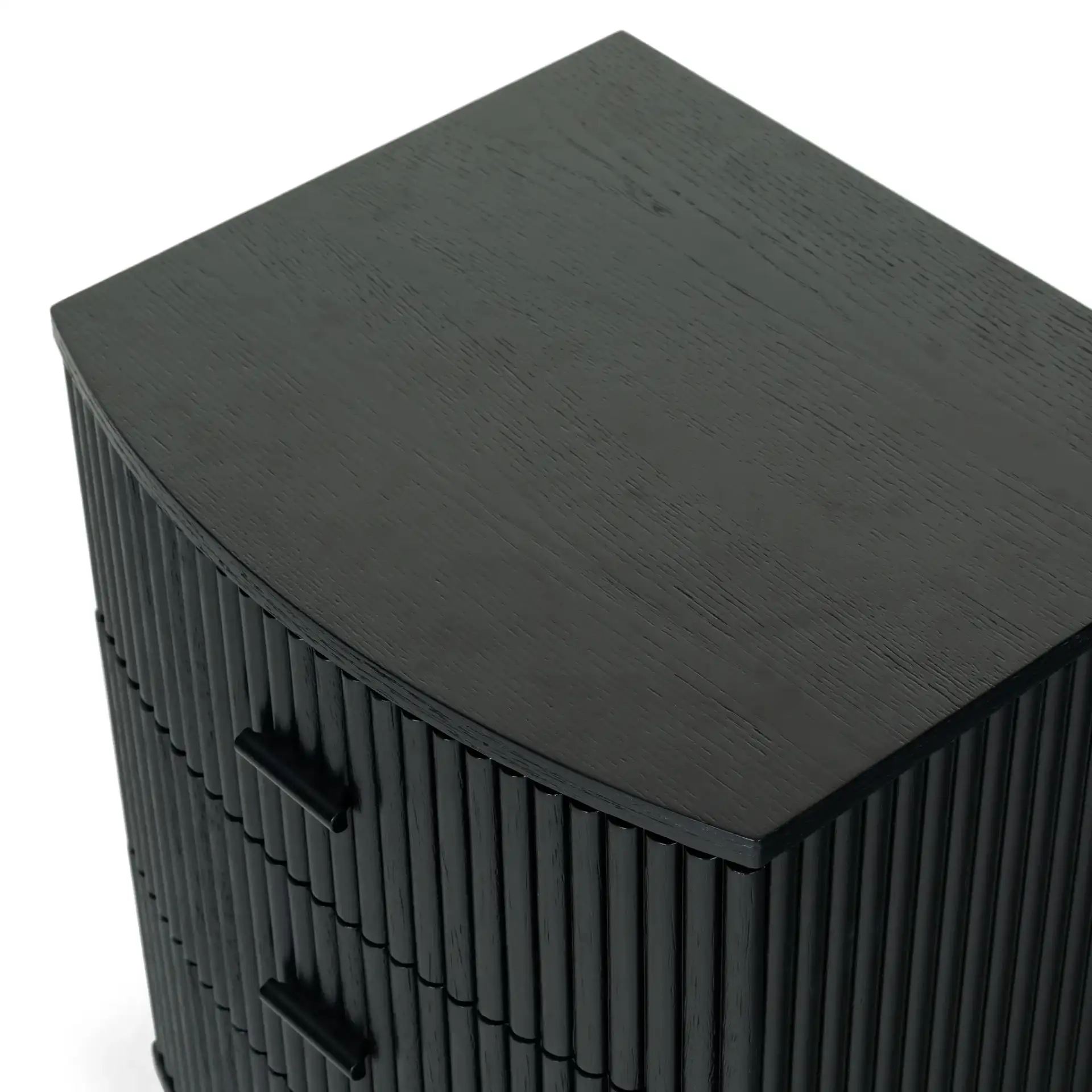 Shelbie Three-Drawer Nightstand in Black in a styled room
