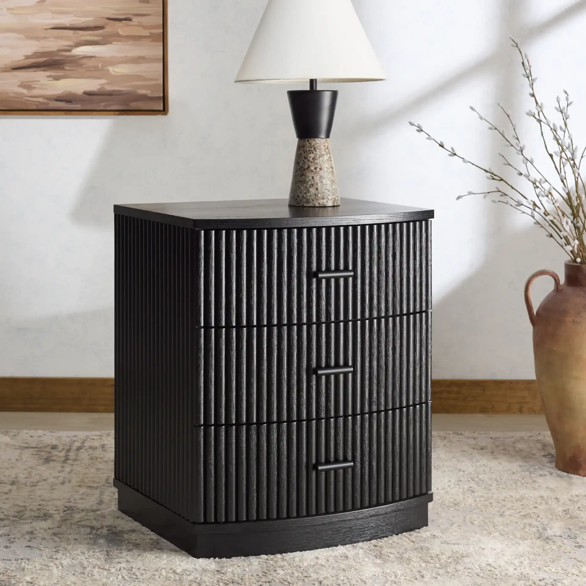 Shelbie Three-Drawer Nightstand in Black in a styled room
