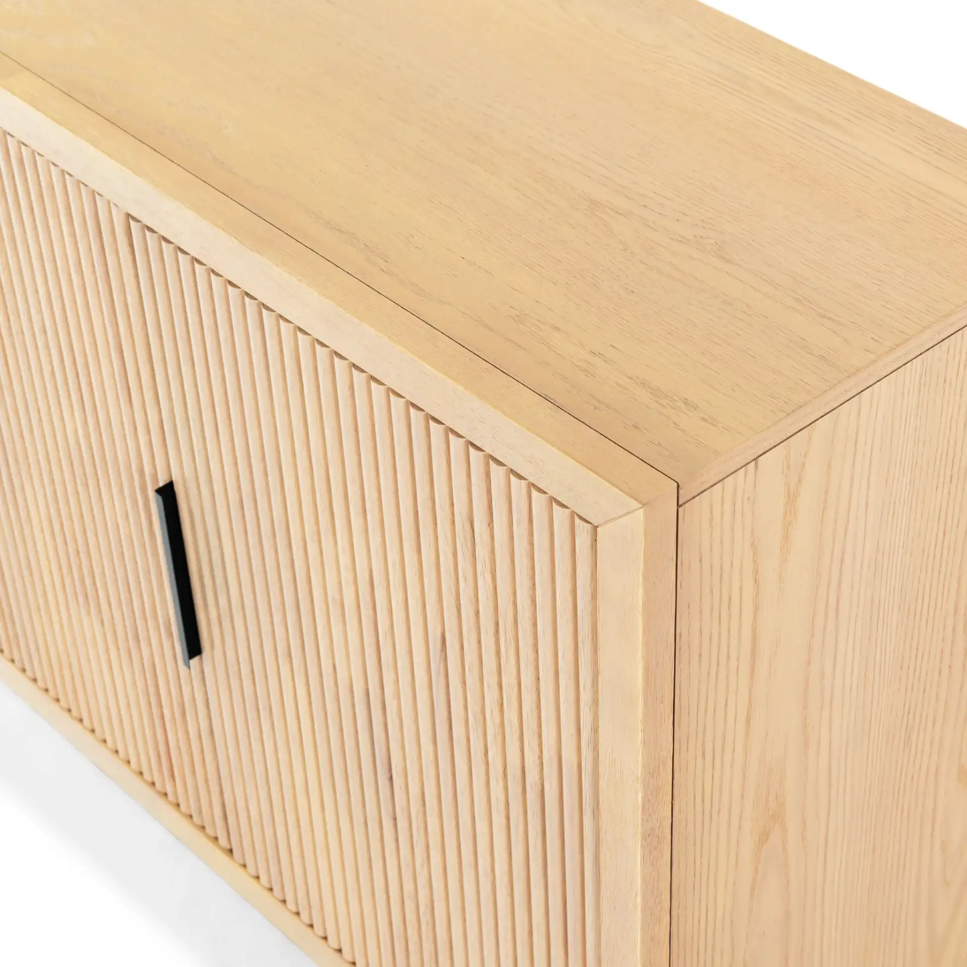 Shelbie Three-Door Reeded Sideboard in Oak / Black in a styled room