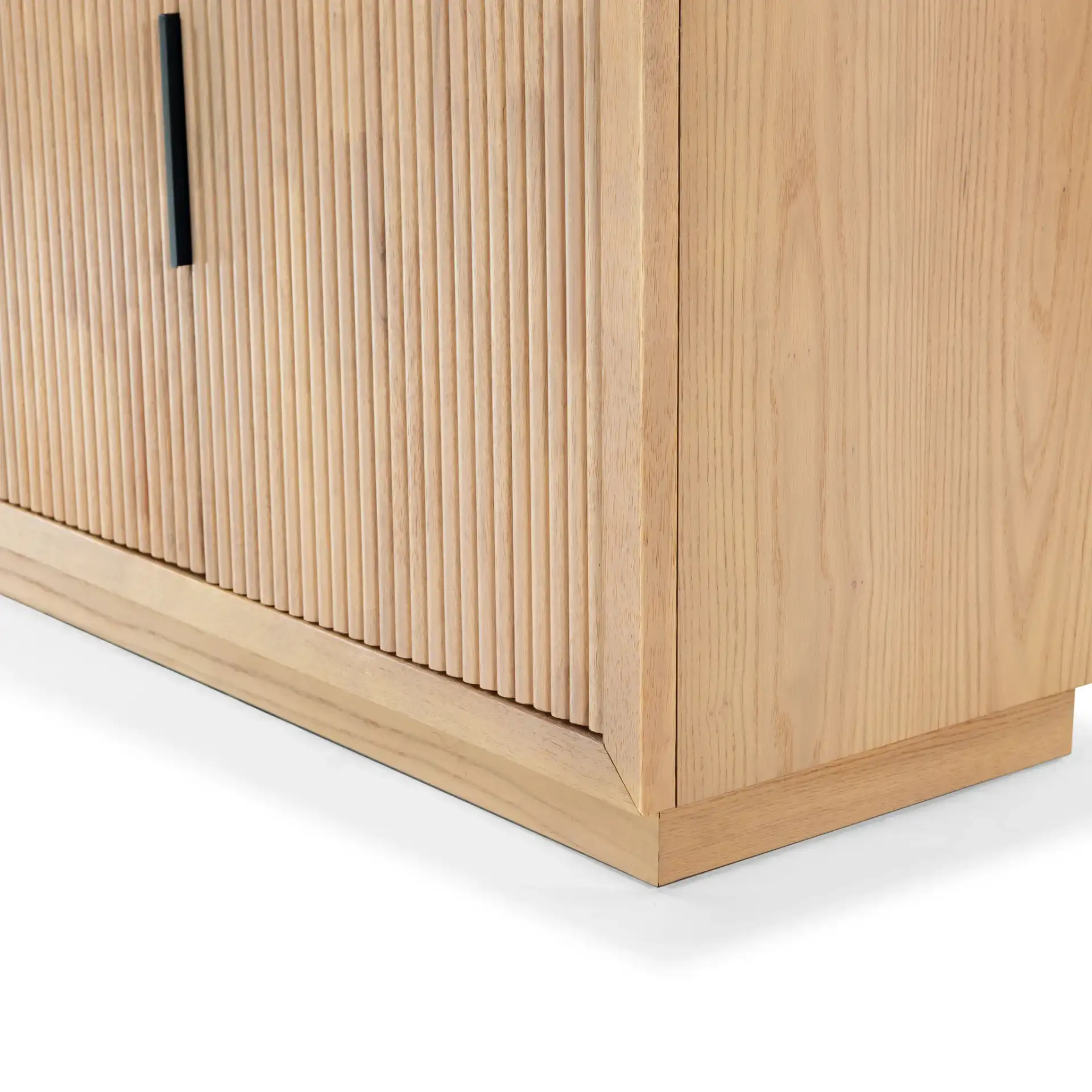 Shelbie Three-Door Reeded Sideboard in Oak / Black in a styled room