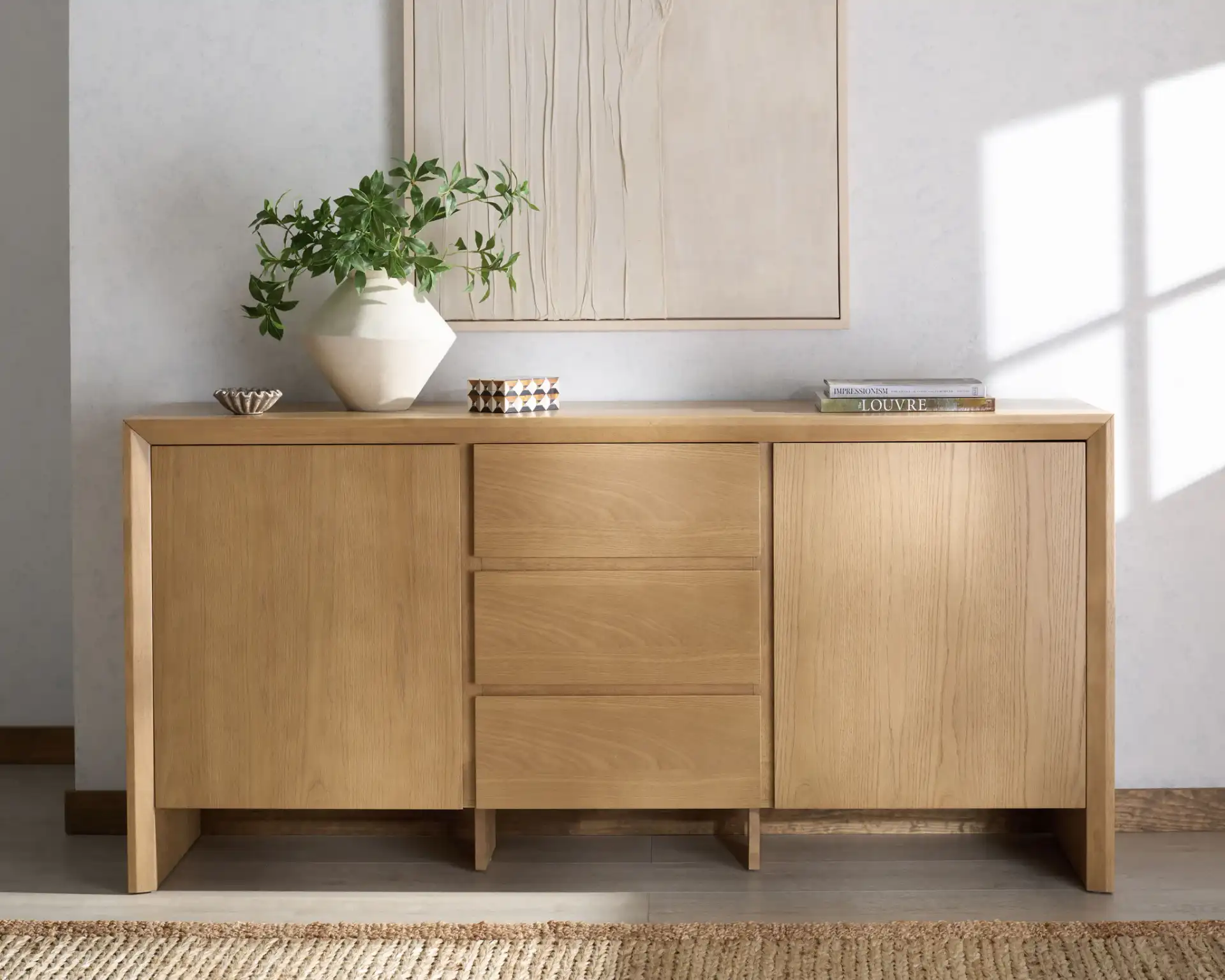 Darnell Wood Three-Drawer Sideboard in Medium Oak in a styled room