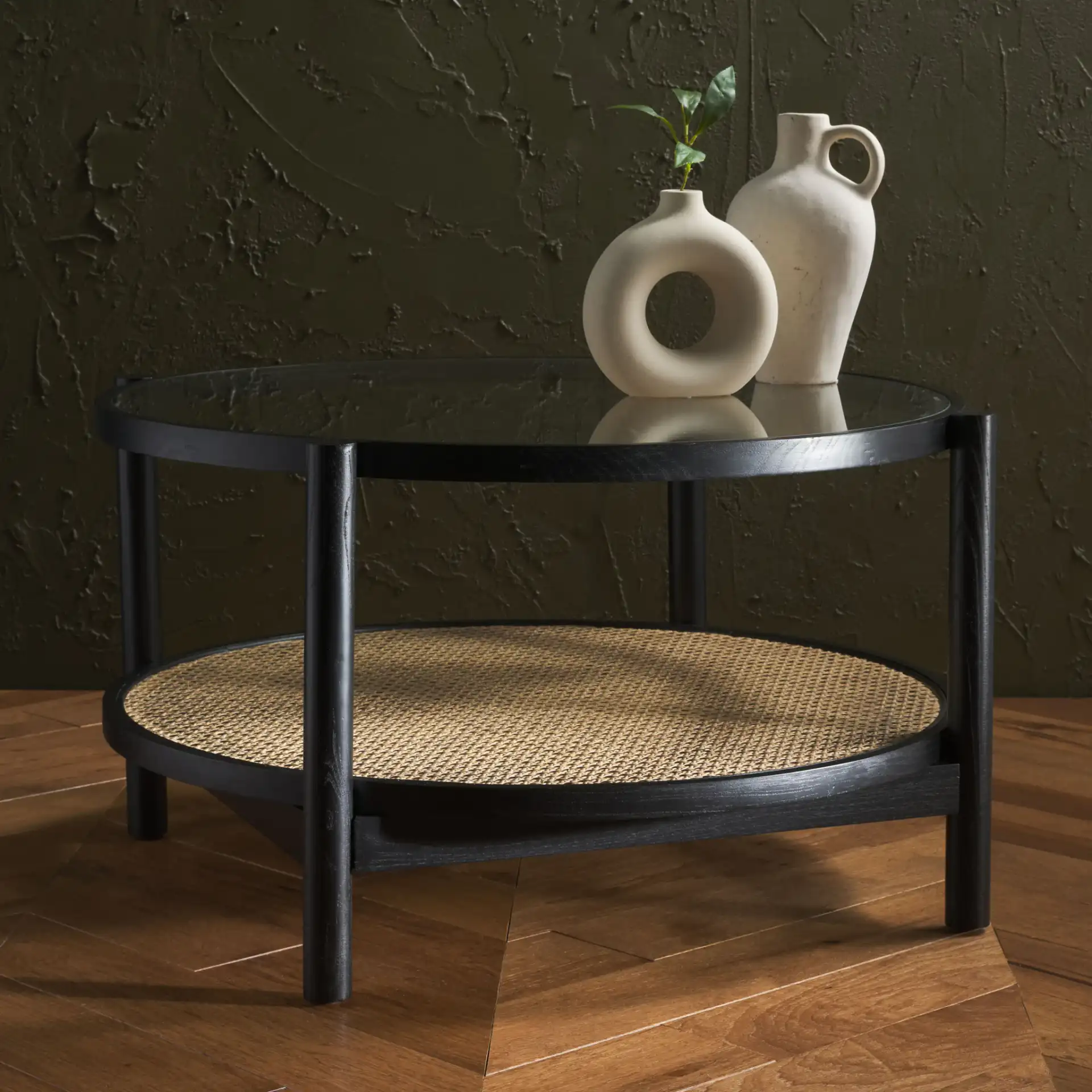 Karyna Rattan & Glass Table in Black / Natural in a styled room
