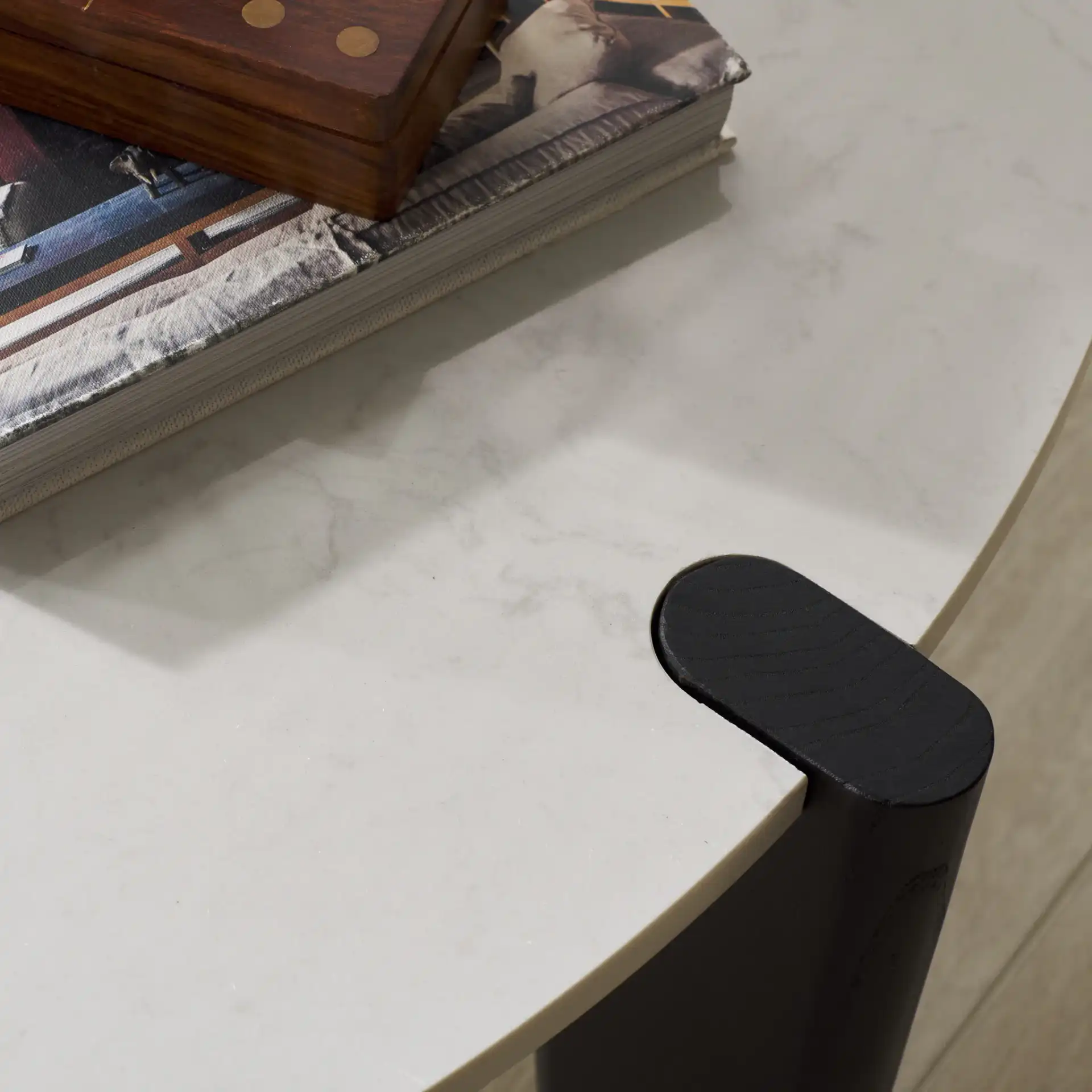 Garcia Marble Top Coffee Table in Black / White in a styled room