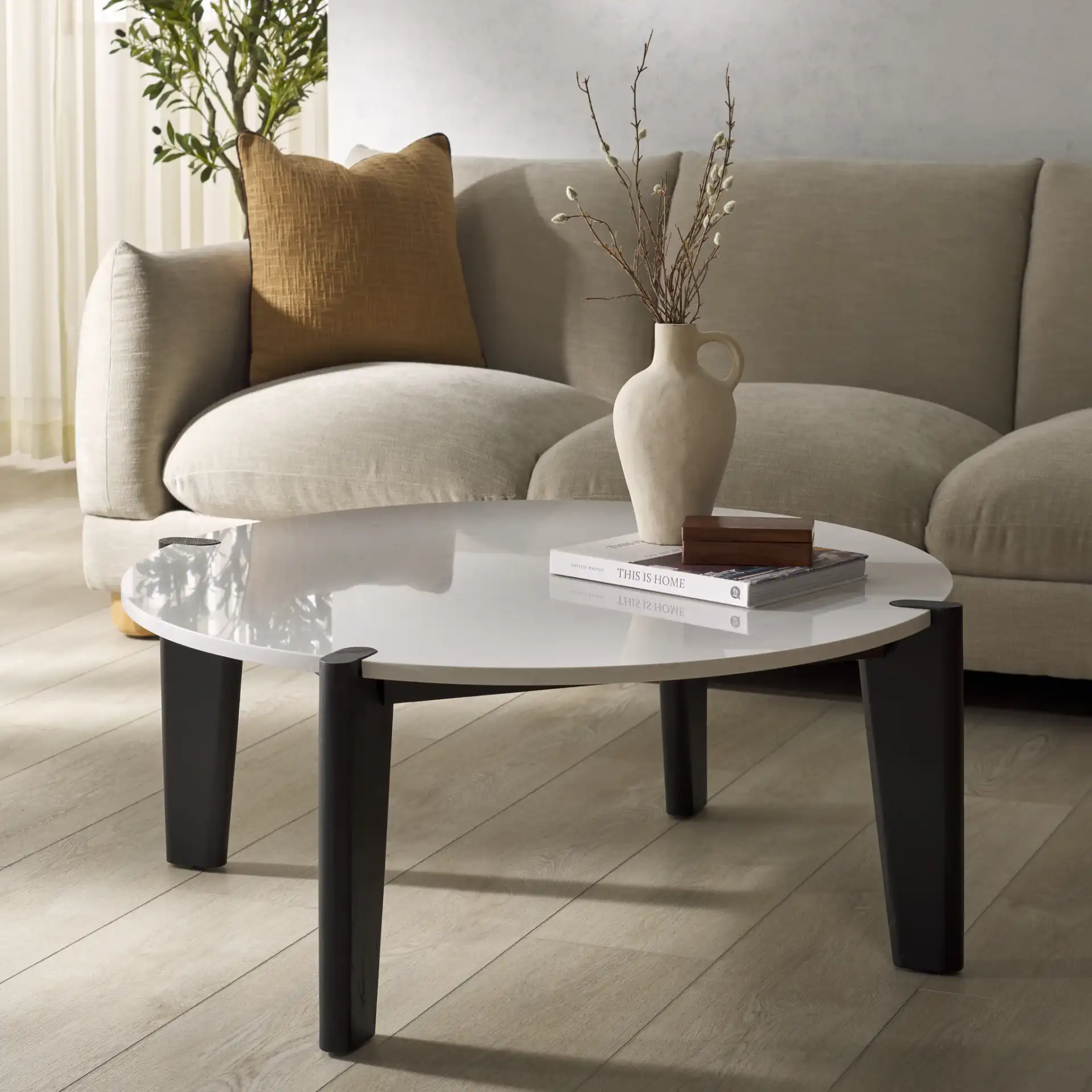 Garcia Marble Top Coffee Table in Black / White in a styled room
