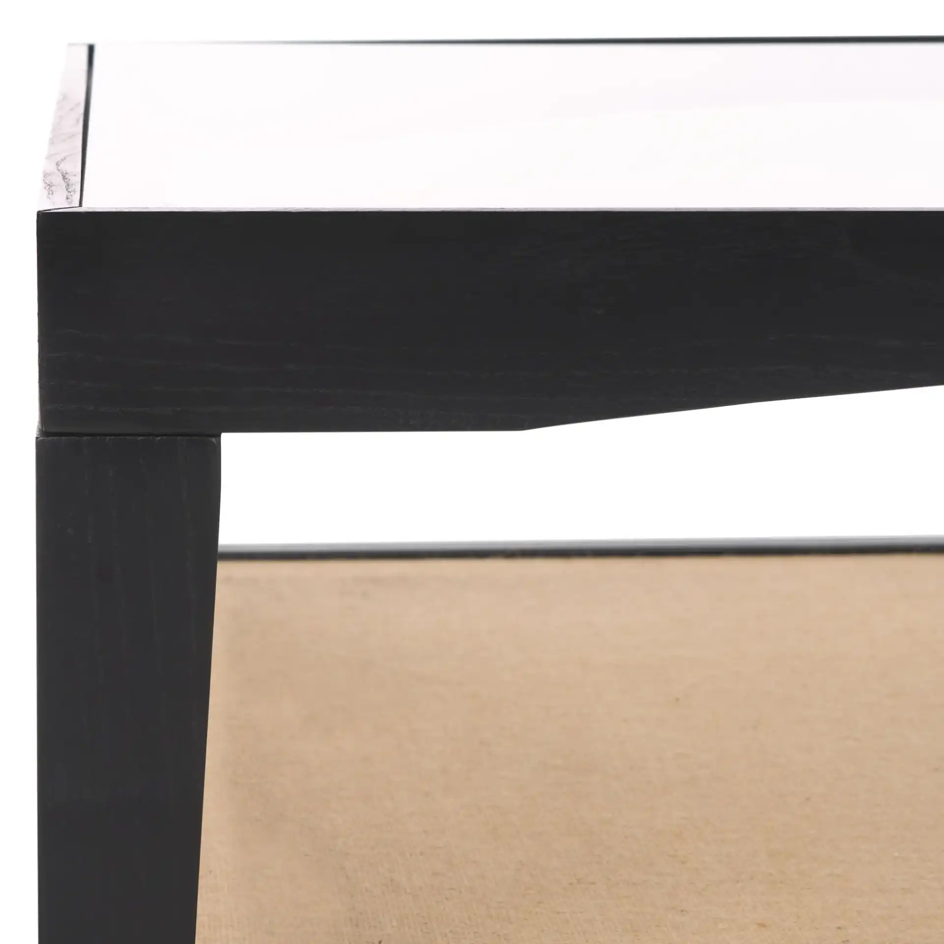 Nicolella Square Glass Coffee Table in Black in a styled room
