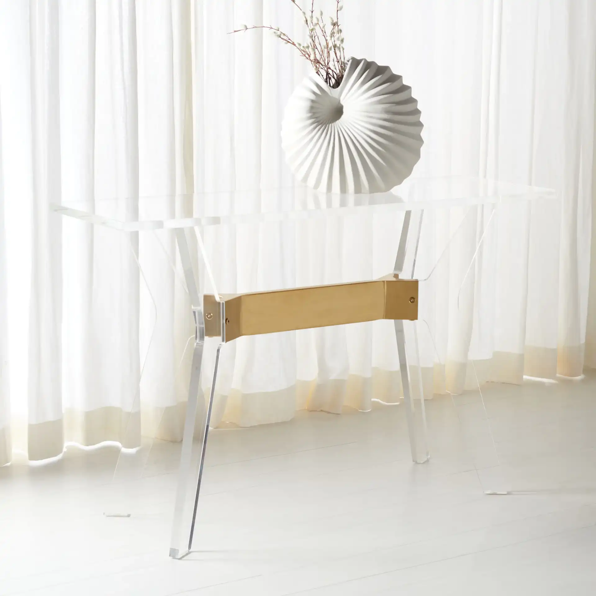 Werner Acrylic Console Table in Brass in a styled room