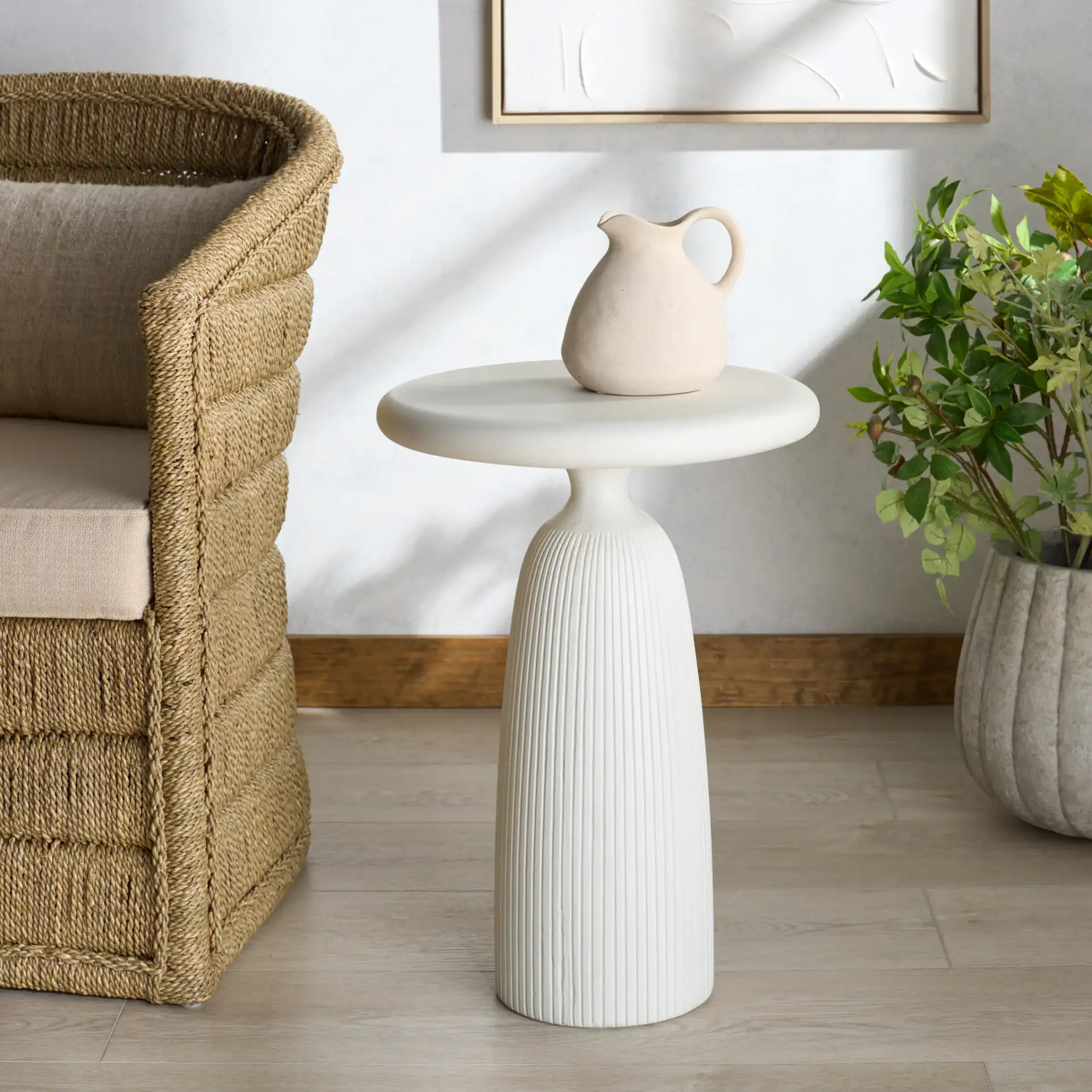 Oskar Round Concrete Accent Table in Brown in a styled room