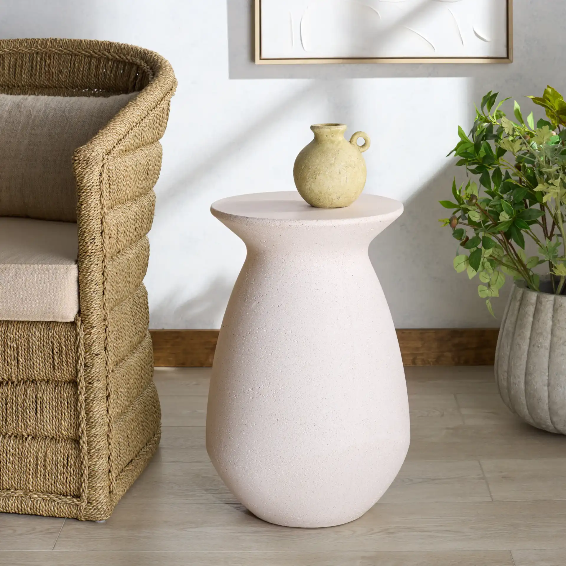 Dynah Concrete Accent Table in Ivory in a styled room