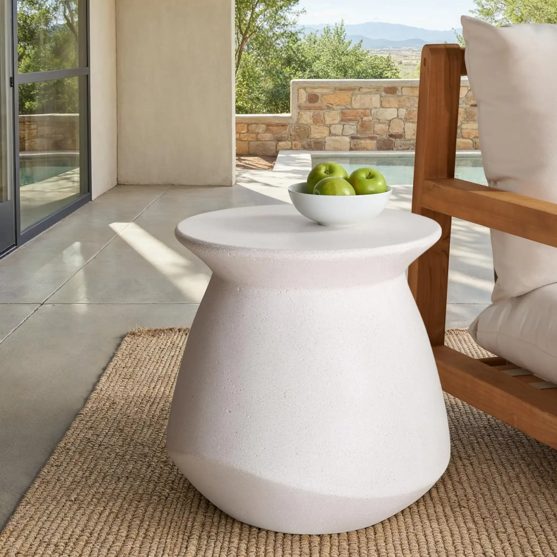 Flanagan Round Accent Table in Ivory in a styled room