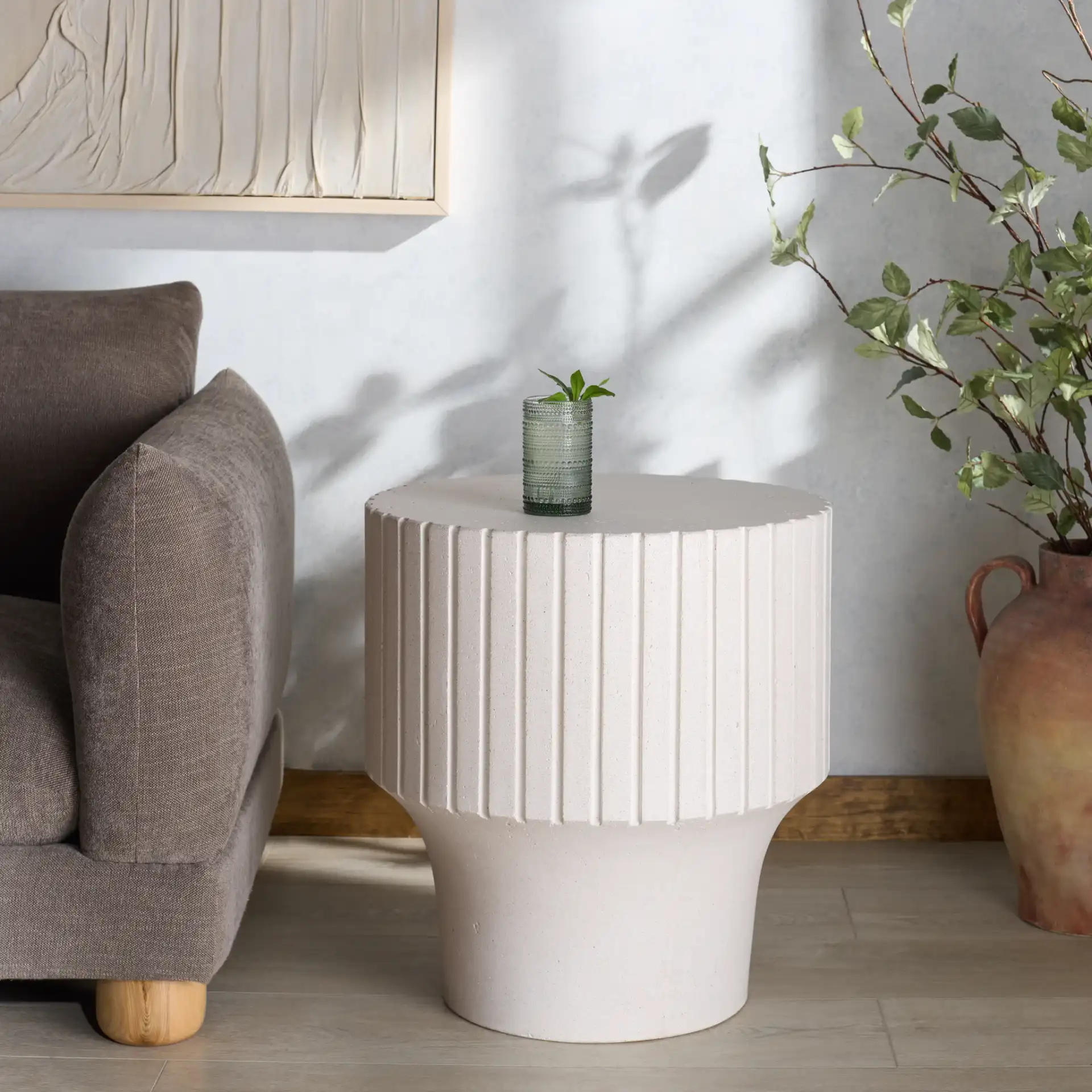 Einstein Round Accent Table in Ivory in a styled room