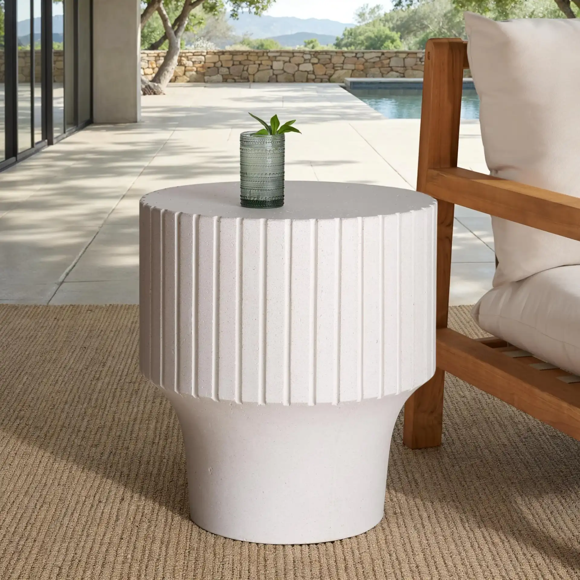 Einstein Round Accent Table in Ivory in a styled room