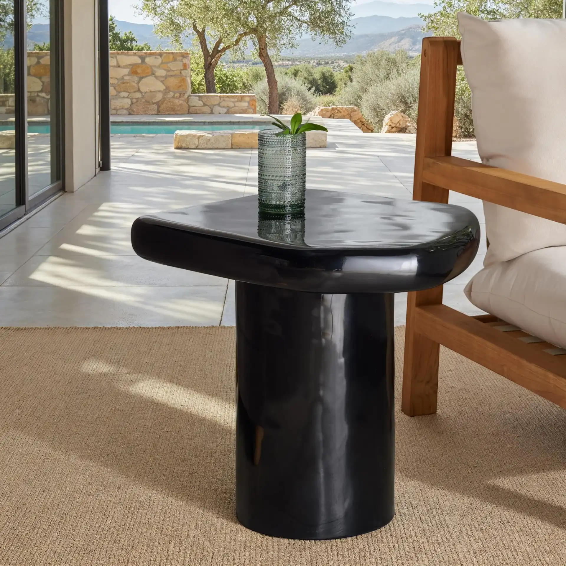 Rhianna Concrete Accent Table in Black in a styled room
