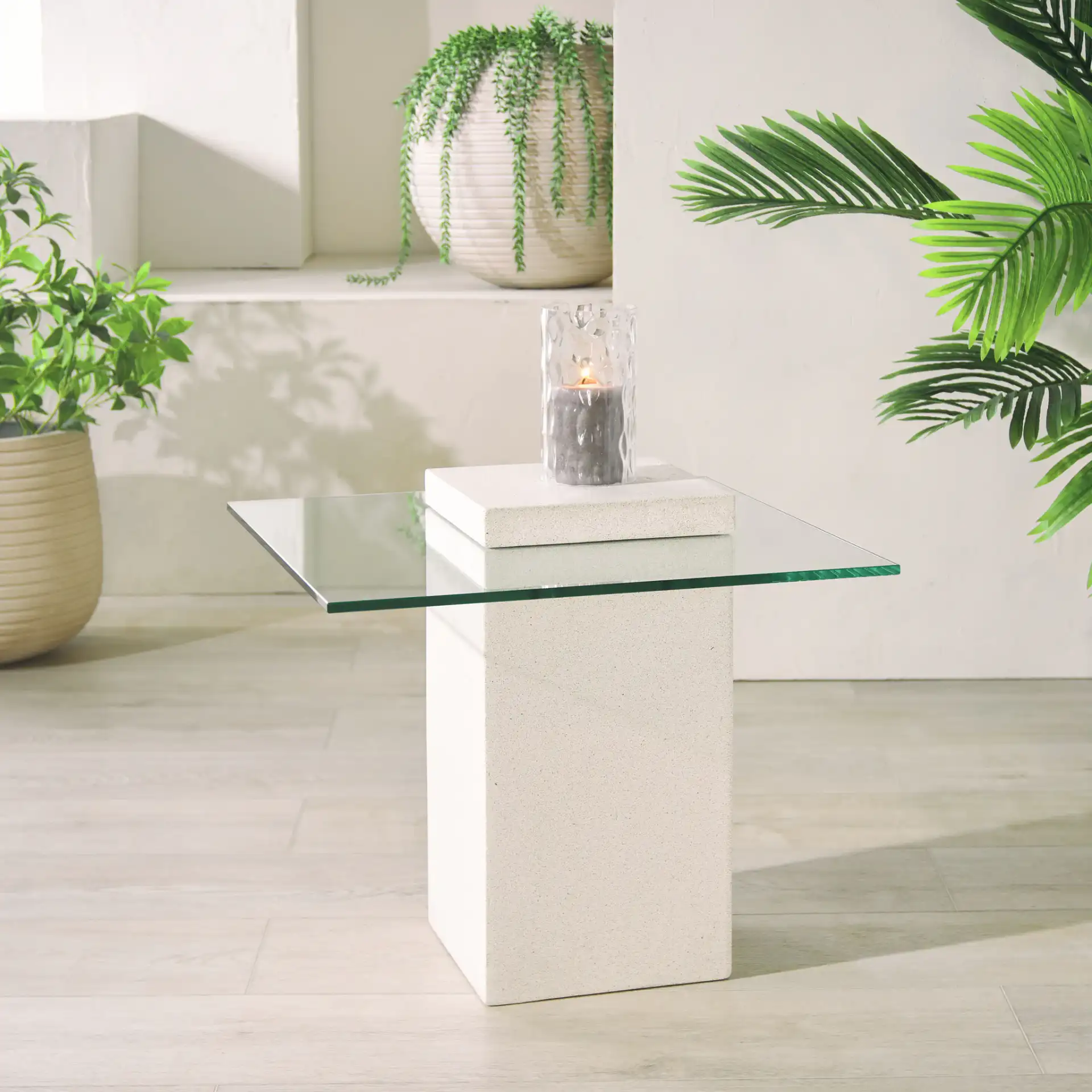 Sophibeth Concrete Accent Table in Ivory / Clear in a styled room