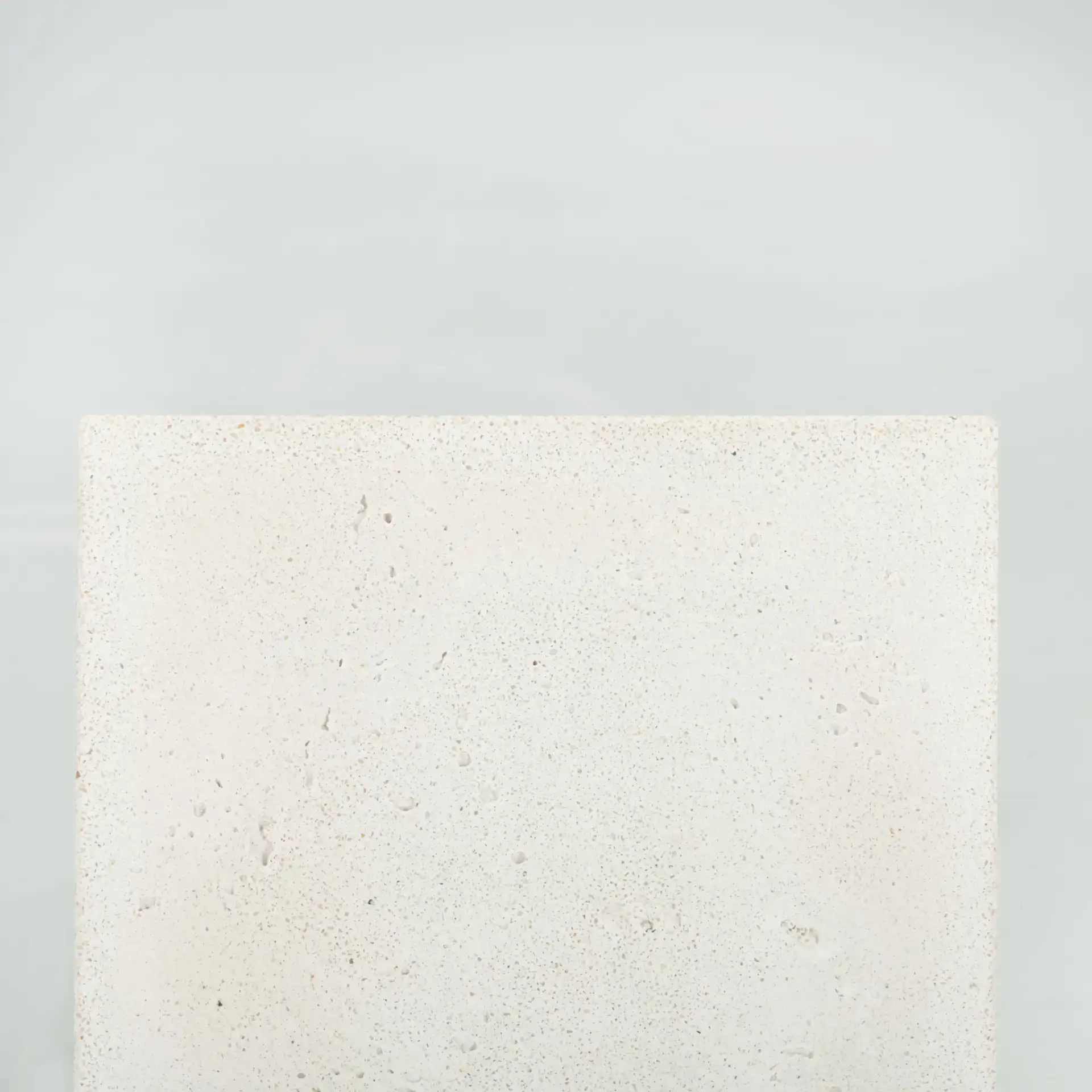 Sophibeth Concrete Accent Table in Ivory / Clear, detail view