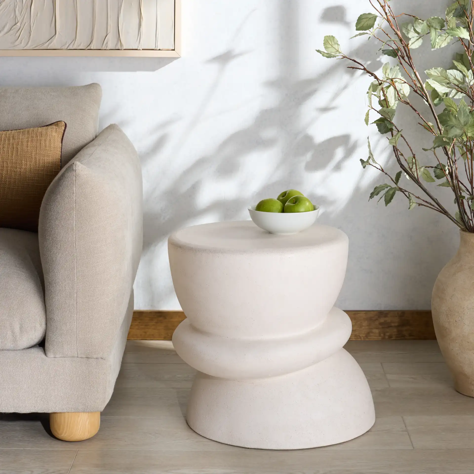 Henrietta Concrete Accent Table in Ivory in a styled room