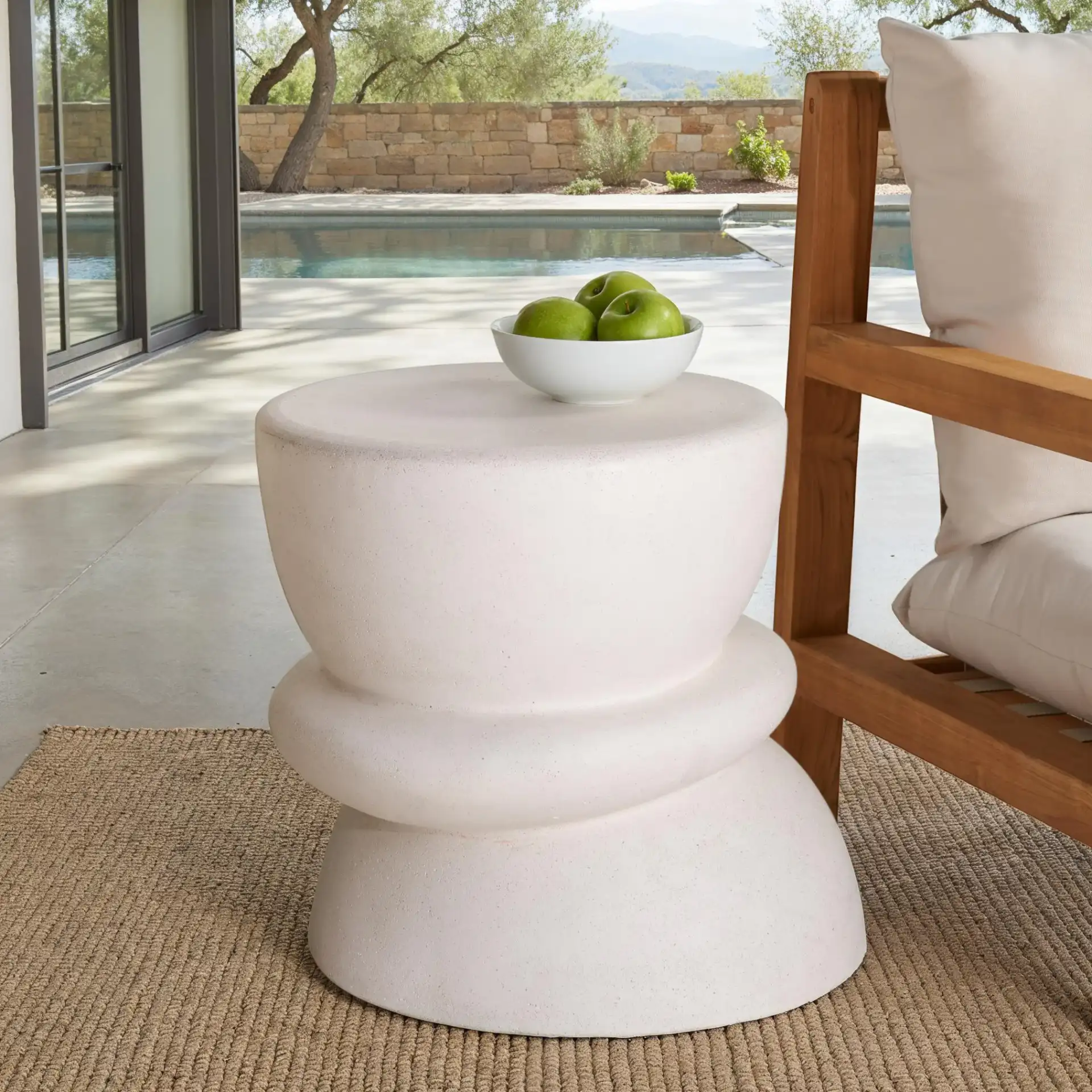 Henrietta Concrete Accent Table in Ivory in a styled room