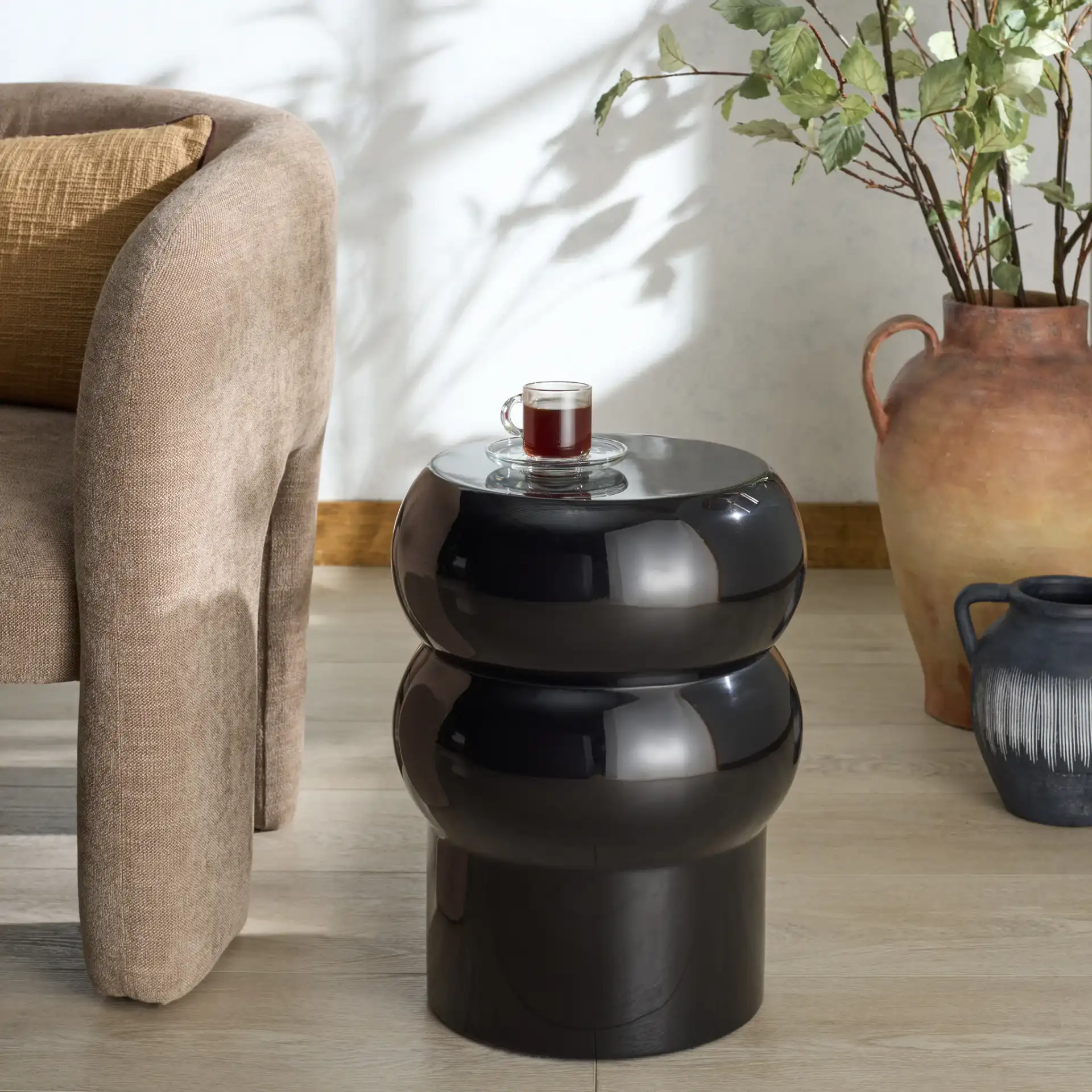 Joyrosa Concrete Accent Table in Black in a styled room