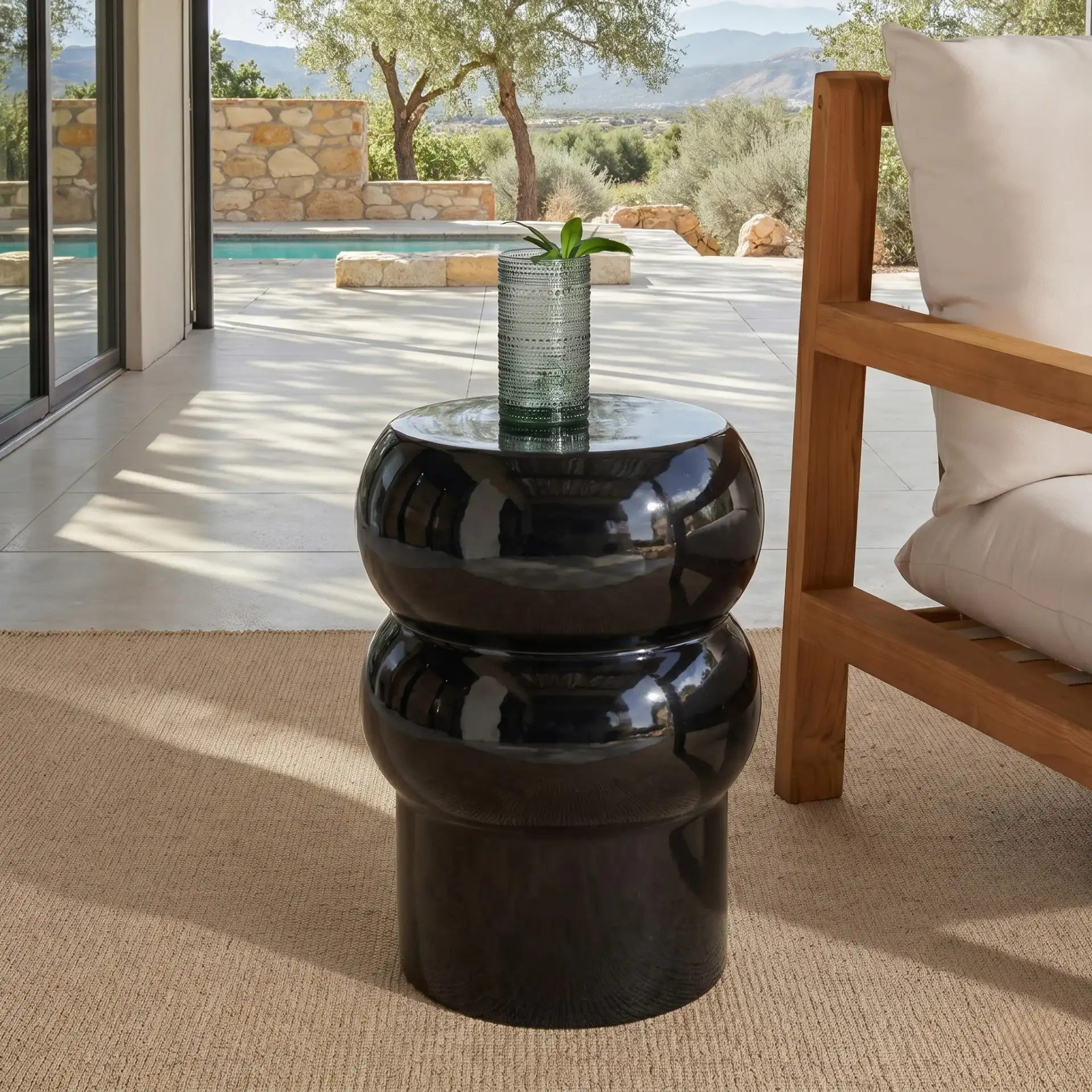 Joyrosa Concrete Accent Table in Black in a styled room