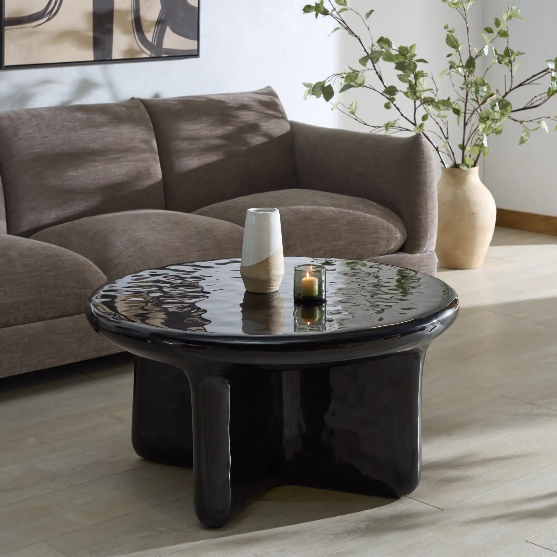 Tressarose Round Coffee Table in Black in a styled room