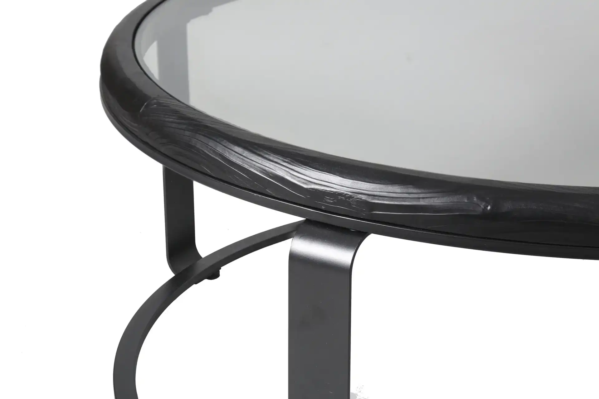 Tyrese Metal Round Coffee Table in Black / Clear in a styled room
