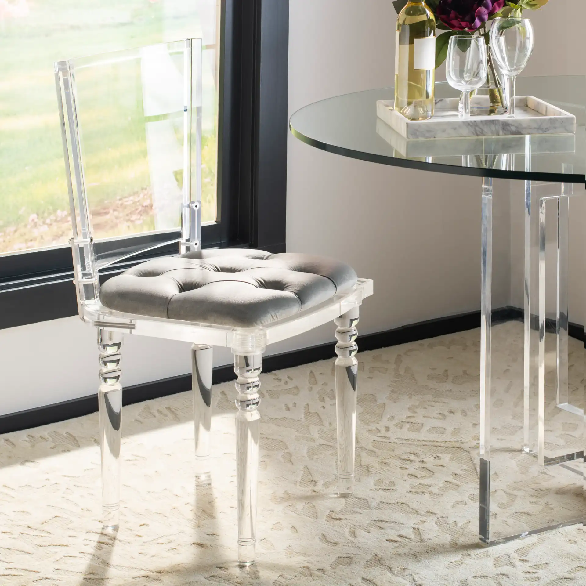 Ella Acrylic Dining Chair in Clear / Gray in a styled room