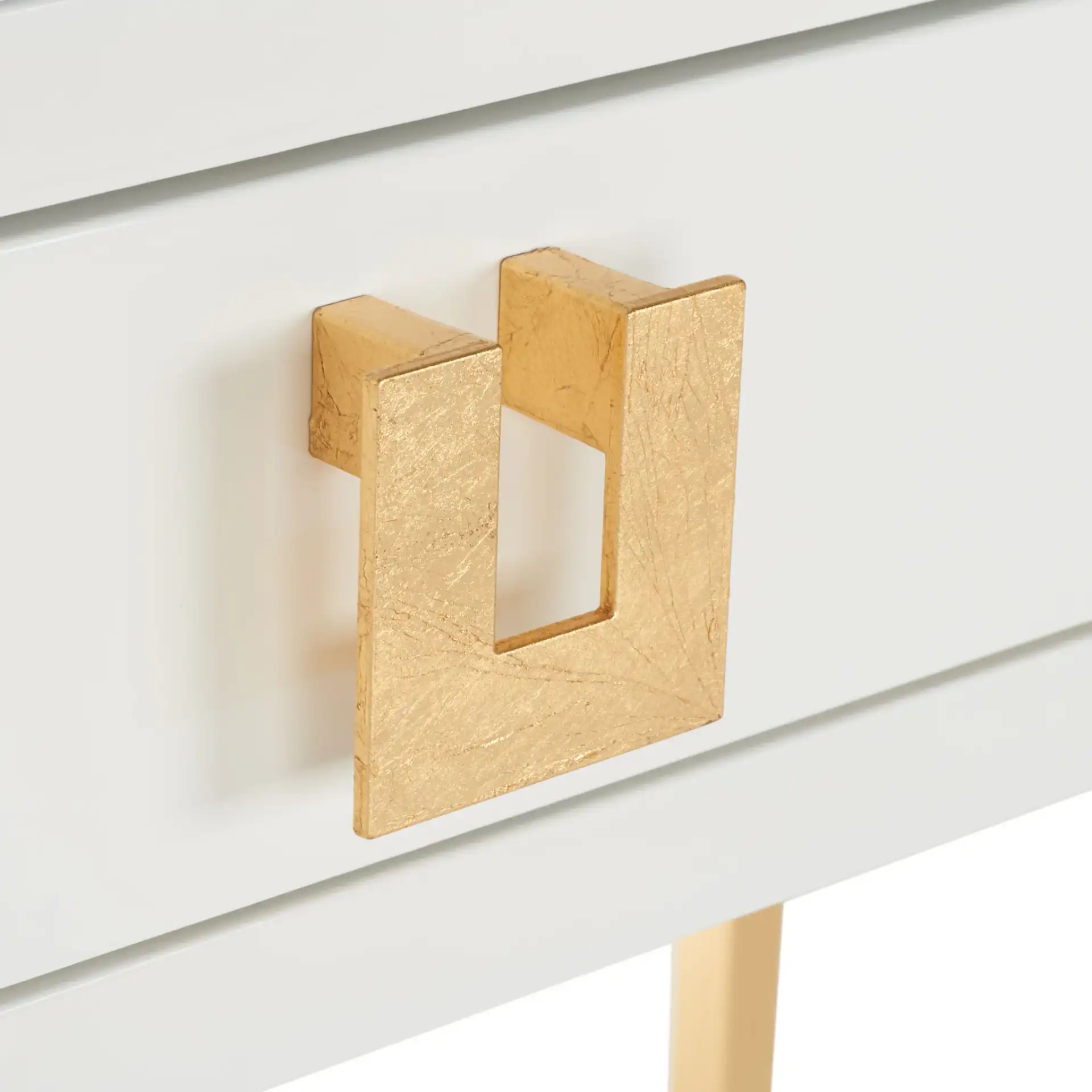 Neria Writing Desk in White / Gold in a styled room