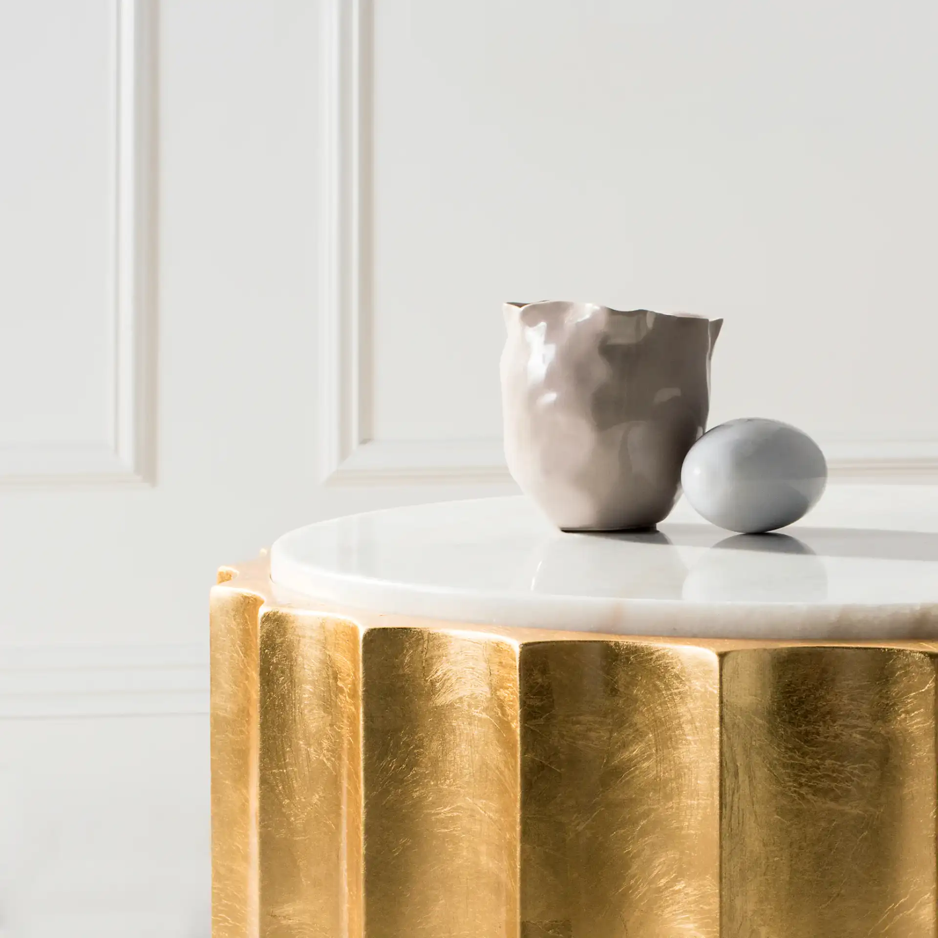 Elodie Gold Side Table in Gold in a styled room
