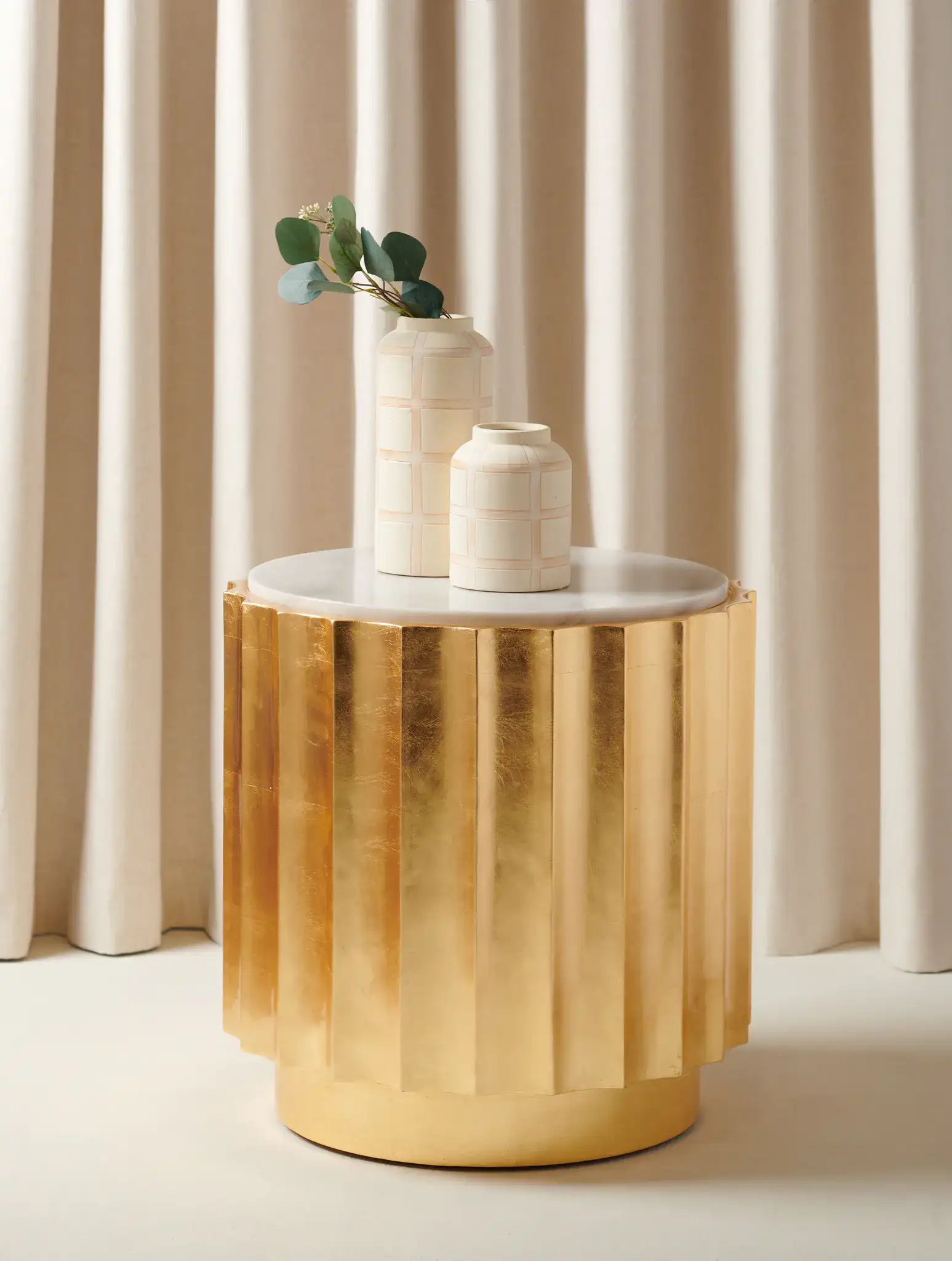 Elodie Gold Side Table in Gold in a styled room