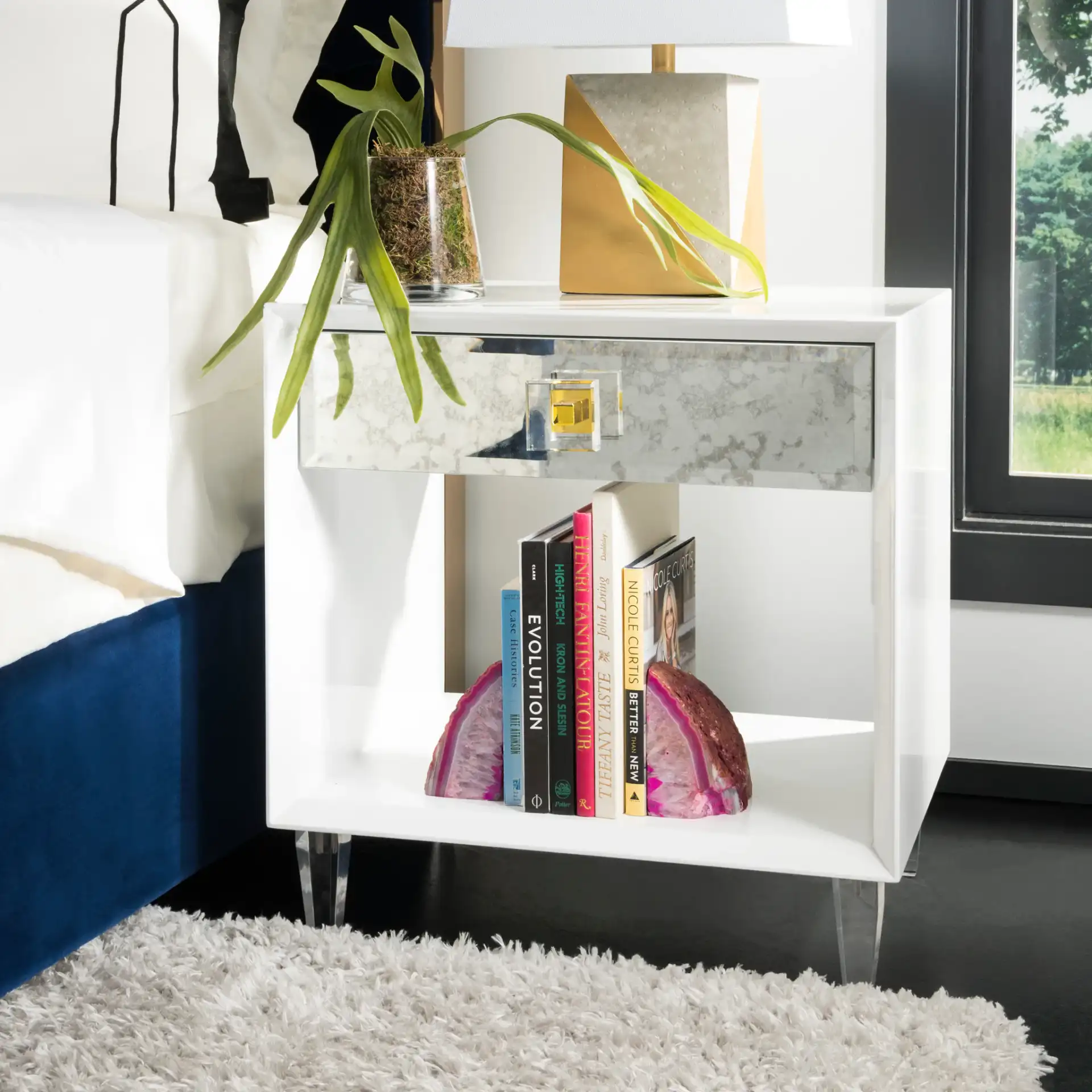 Arcelia Eglomise Side Table in White in a styled room