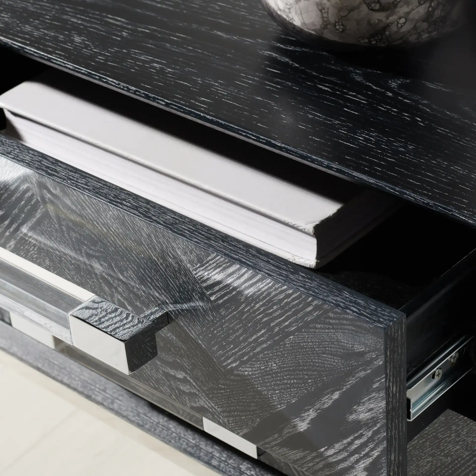 Sanford Two-Drawer Side Table in Black Cerused Oak in a styled room