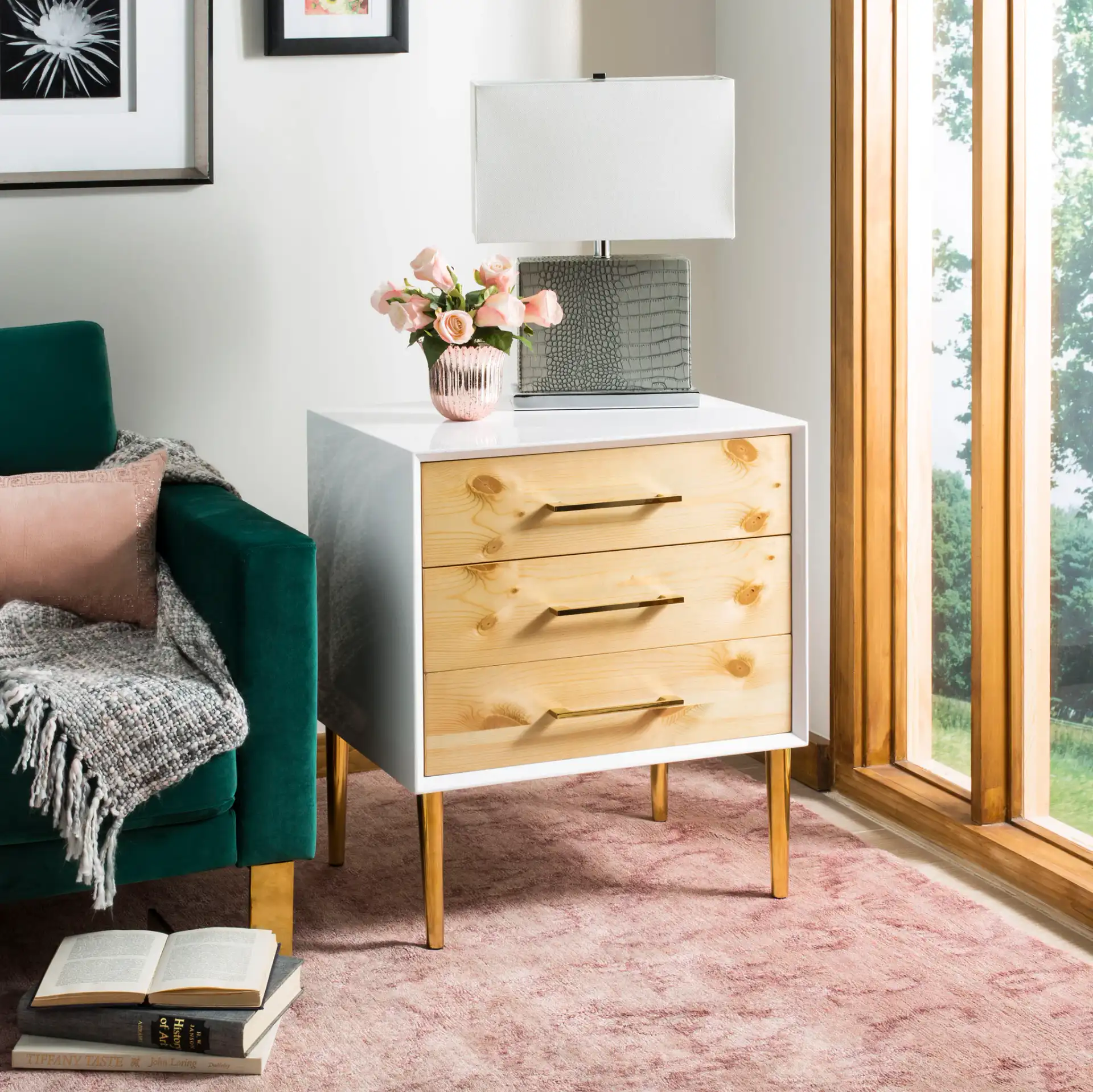 Vanda Three-Drawer Side Table in White in a styled room
