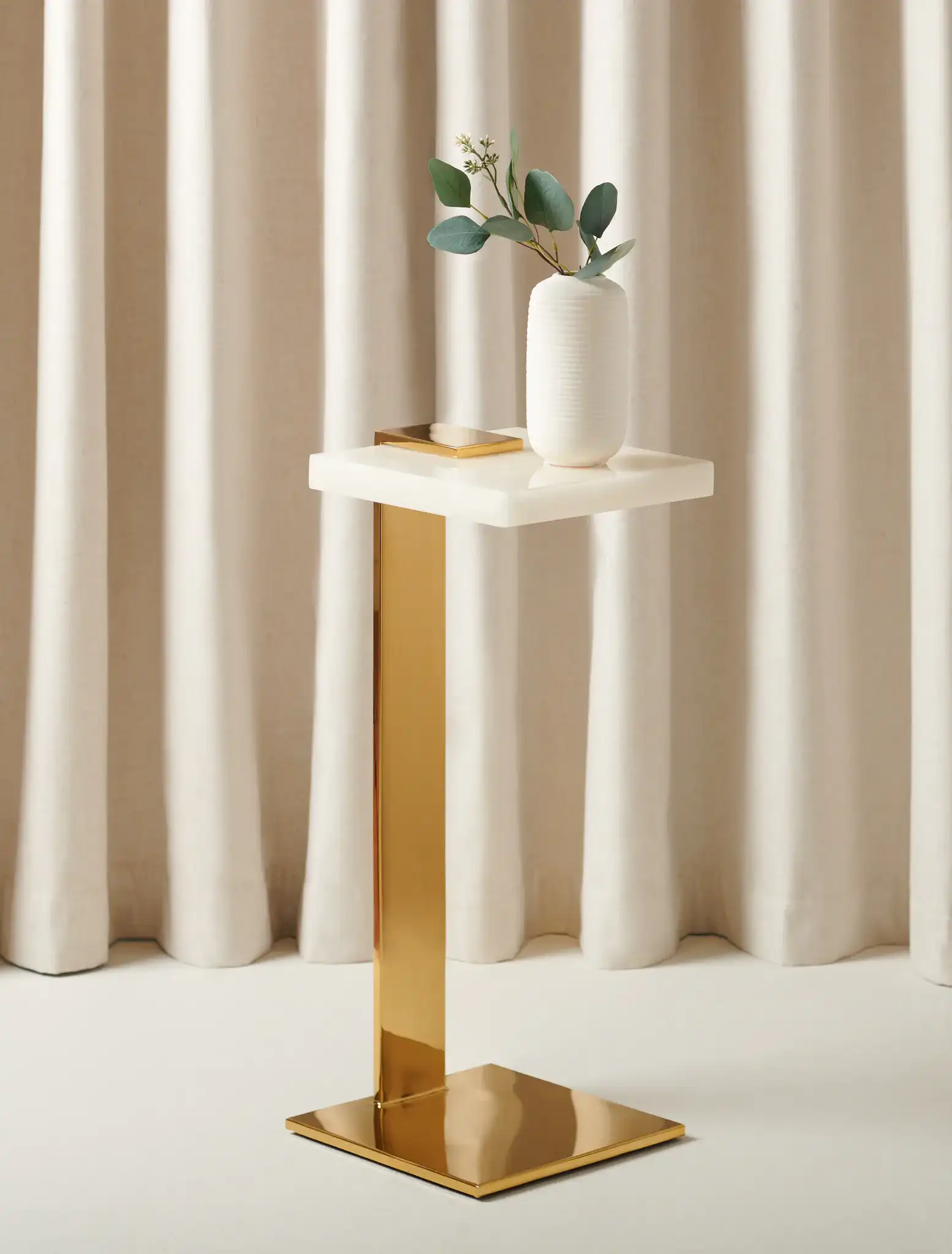 Mars Acrylic Drink Table in Clear / Gold in a styled room