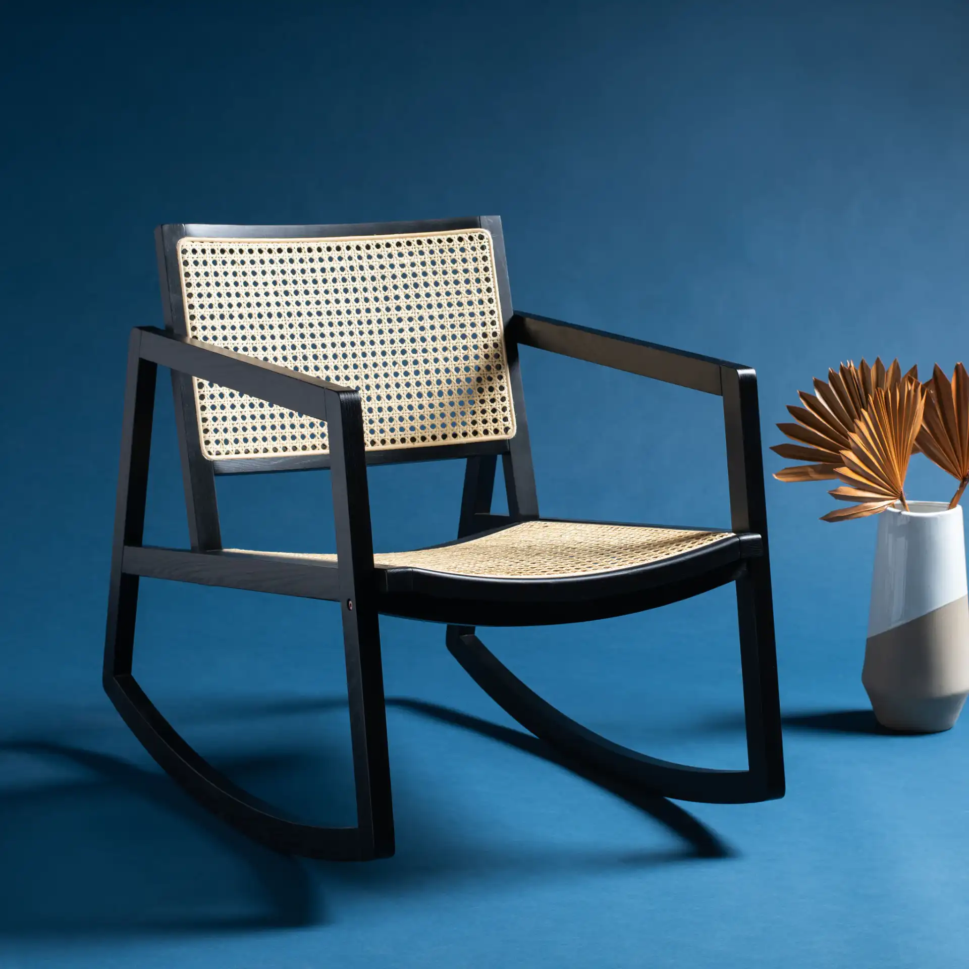 Perth Rattan Rocking Chair in Black / Natural in a styled room