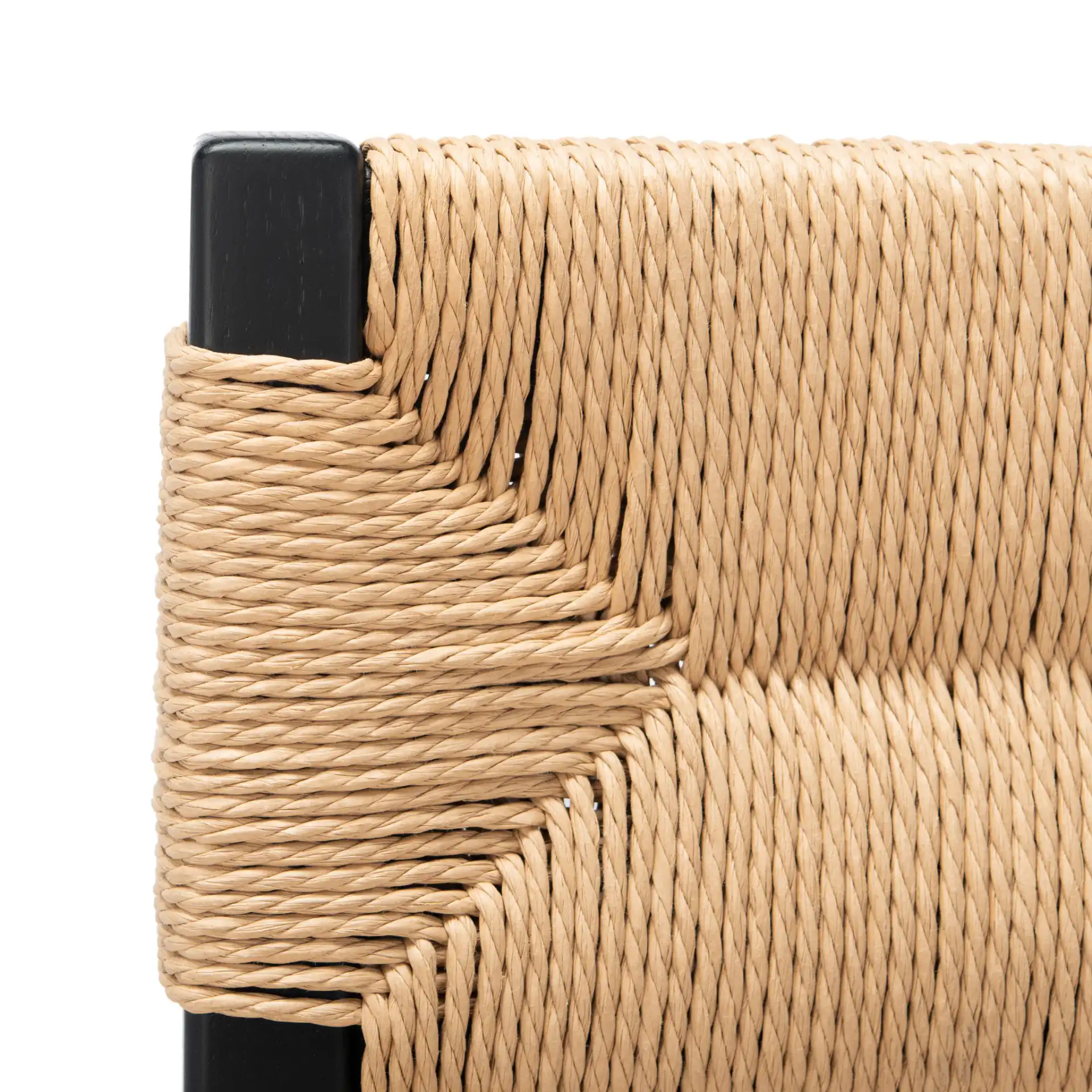 Cody Rattan Dining Chair (Set of 2) in Black / Natural in a styled room