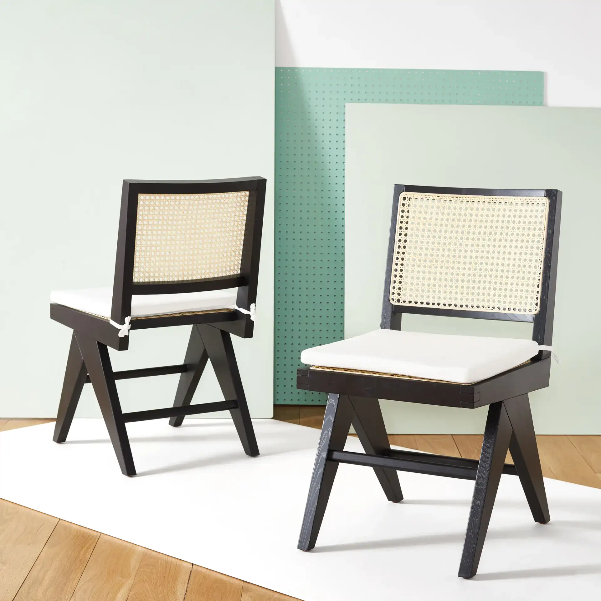 Colette Rattan Dining Chair (Set of 2) in Black / Natural in a styled room