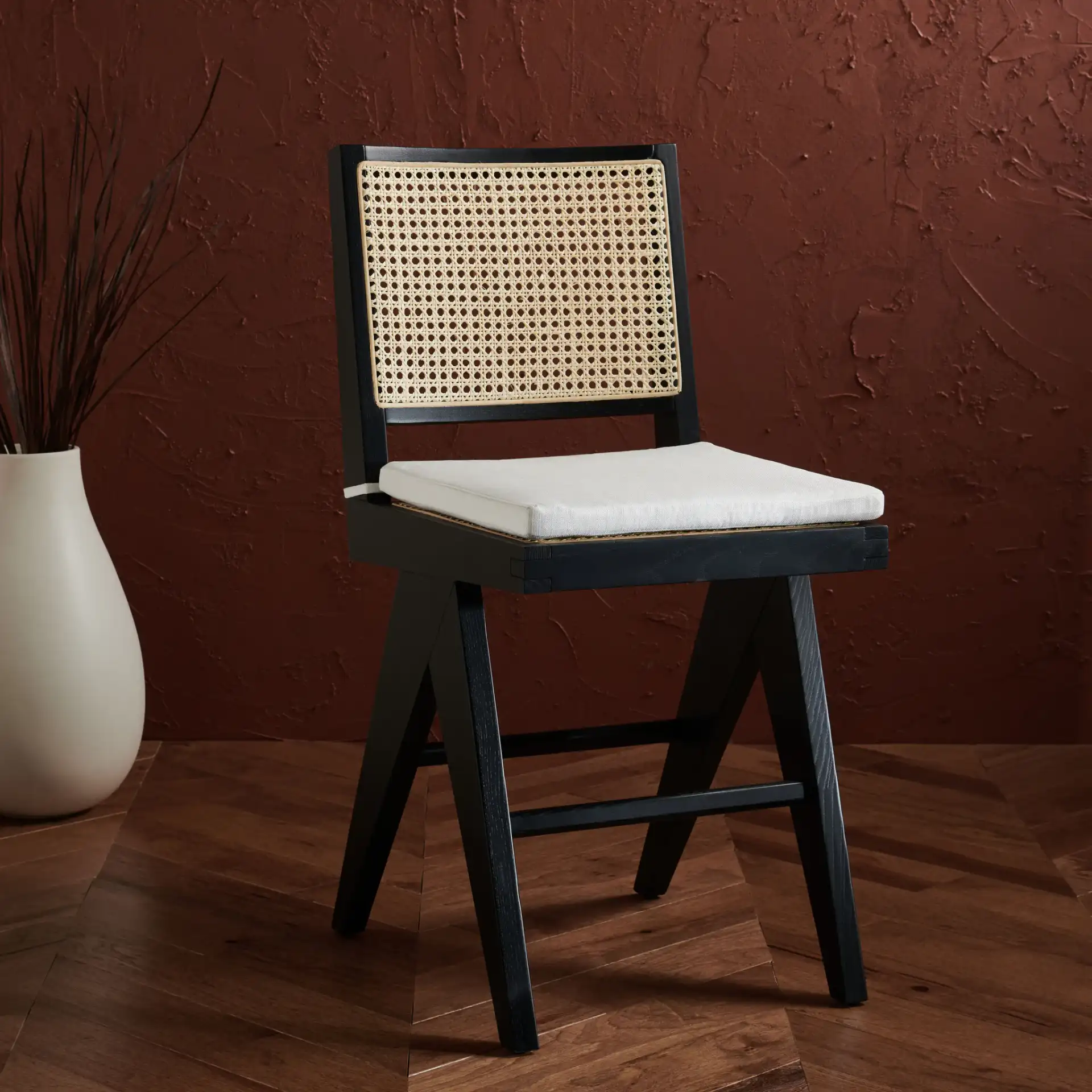 Colette Rattan Counter Stool in Black / Natural in a styled room