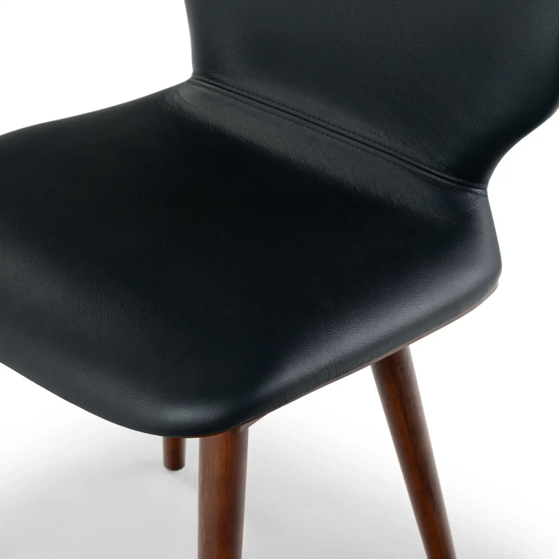 Tazmyn Dining Chair in Black / Walnut in a styled room