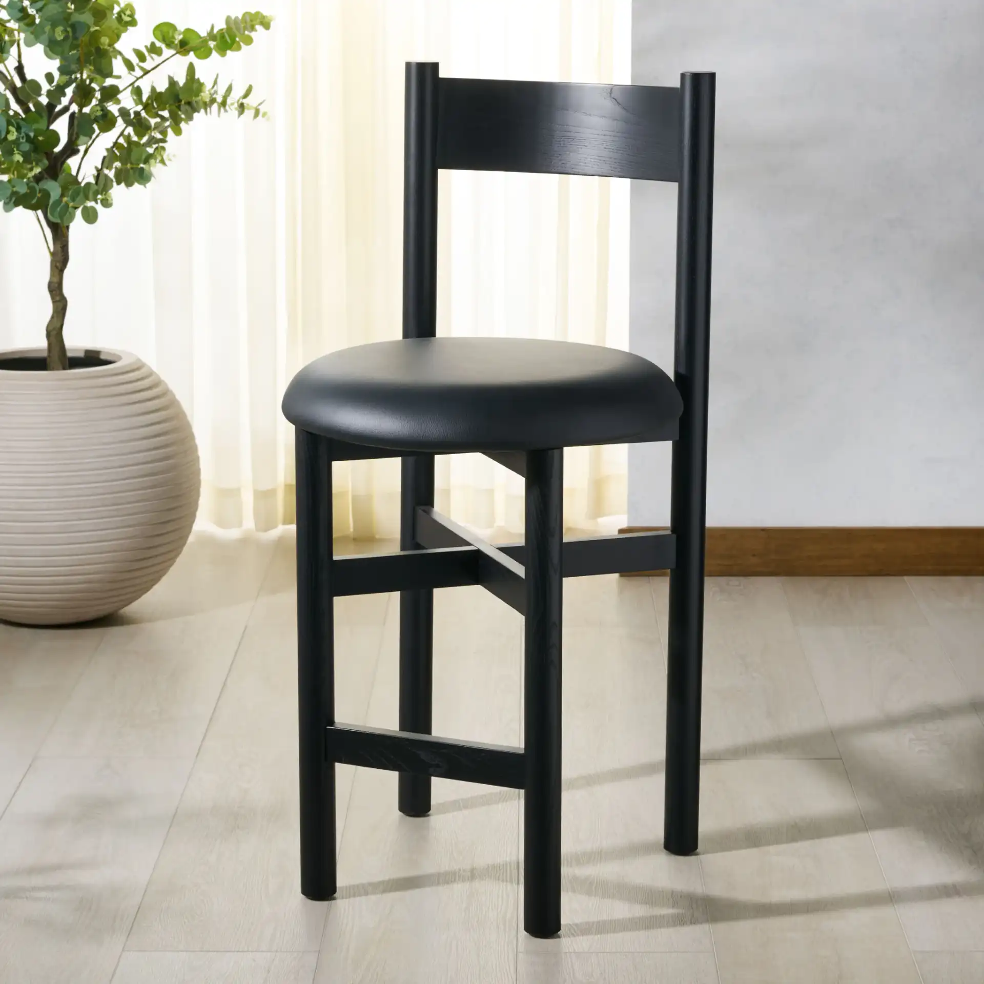 Tayla Counter Stool in Black in a styled room