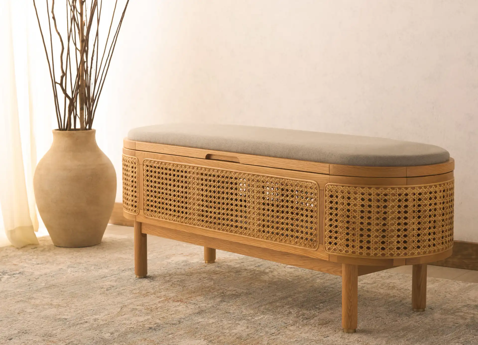 Dolly Cane And Wood Storage Bench in Natural / Gray in a styled room