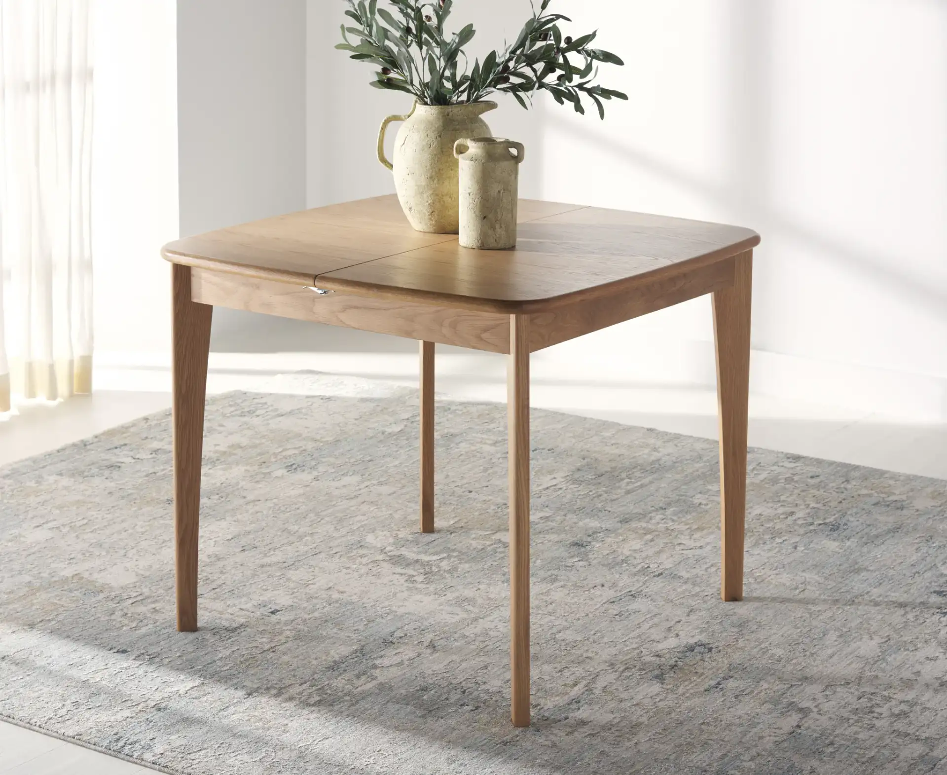 Barbossa Extendable Dining Table in Natural in a styled room