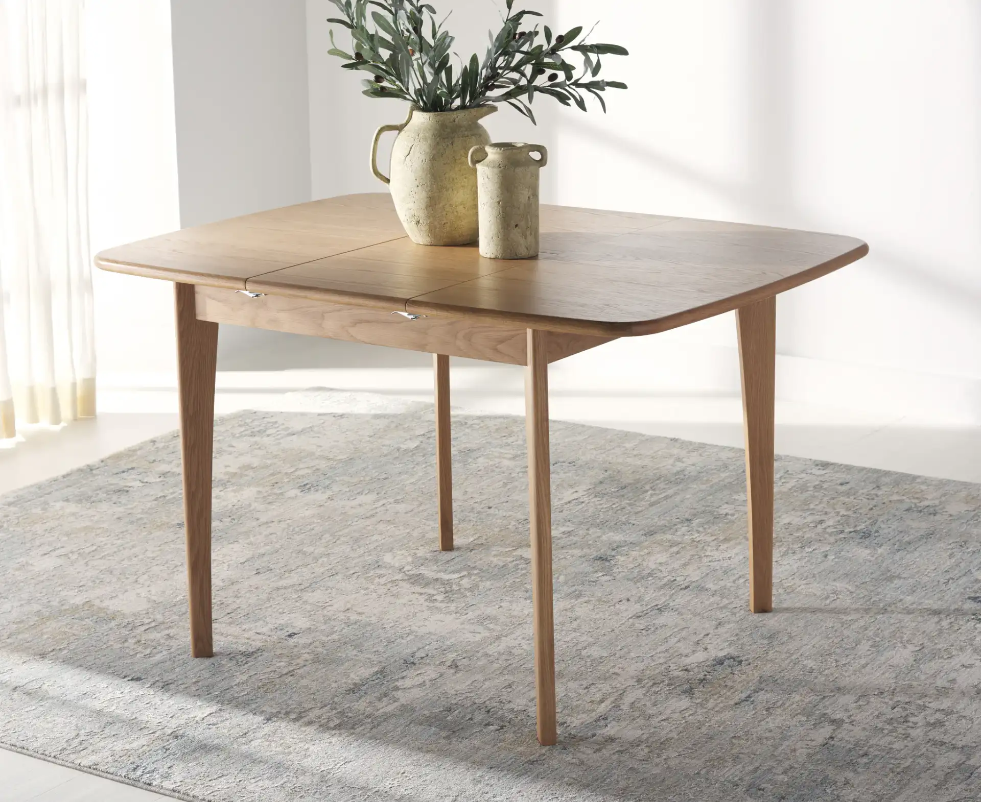 Barbossa Extendable Dining Table in Natural in a styled room