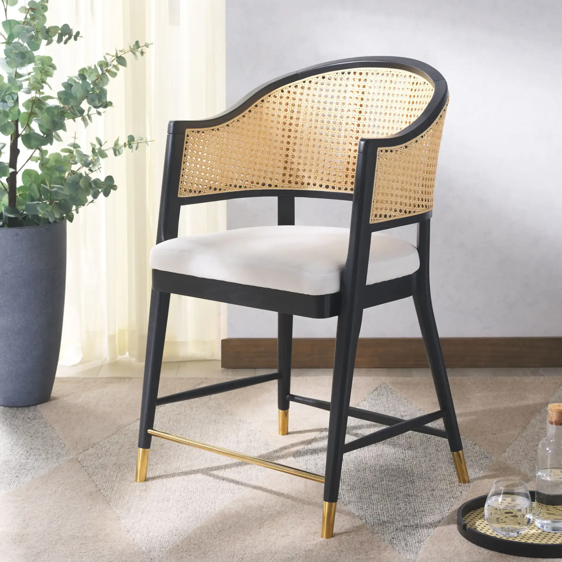 Rogue Rattan Counter Stool in Black / Natural in a styled room