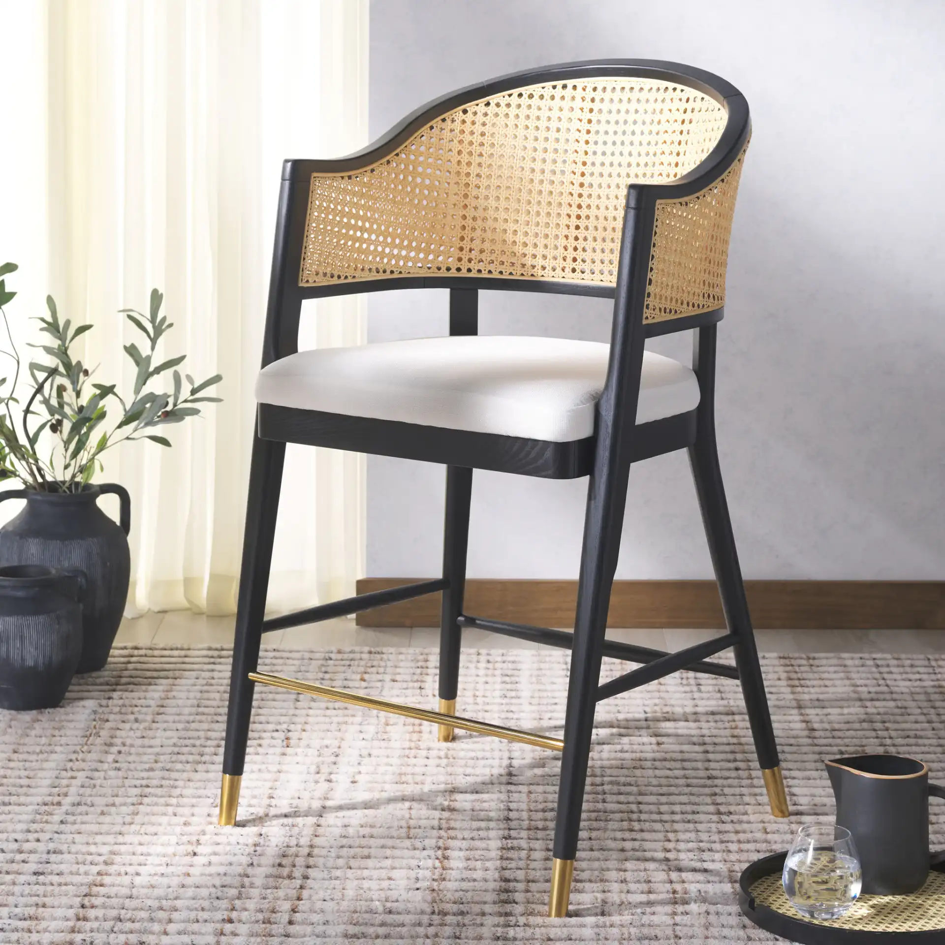 Rogue Rattan Barstool in Black / Natural in a styled room