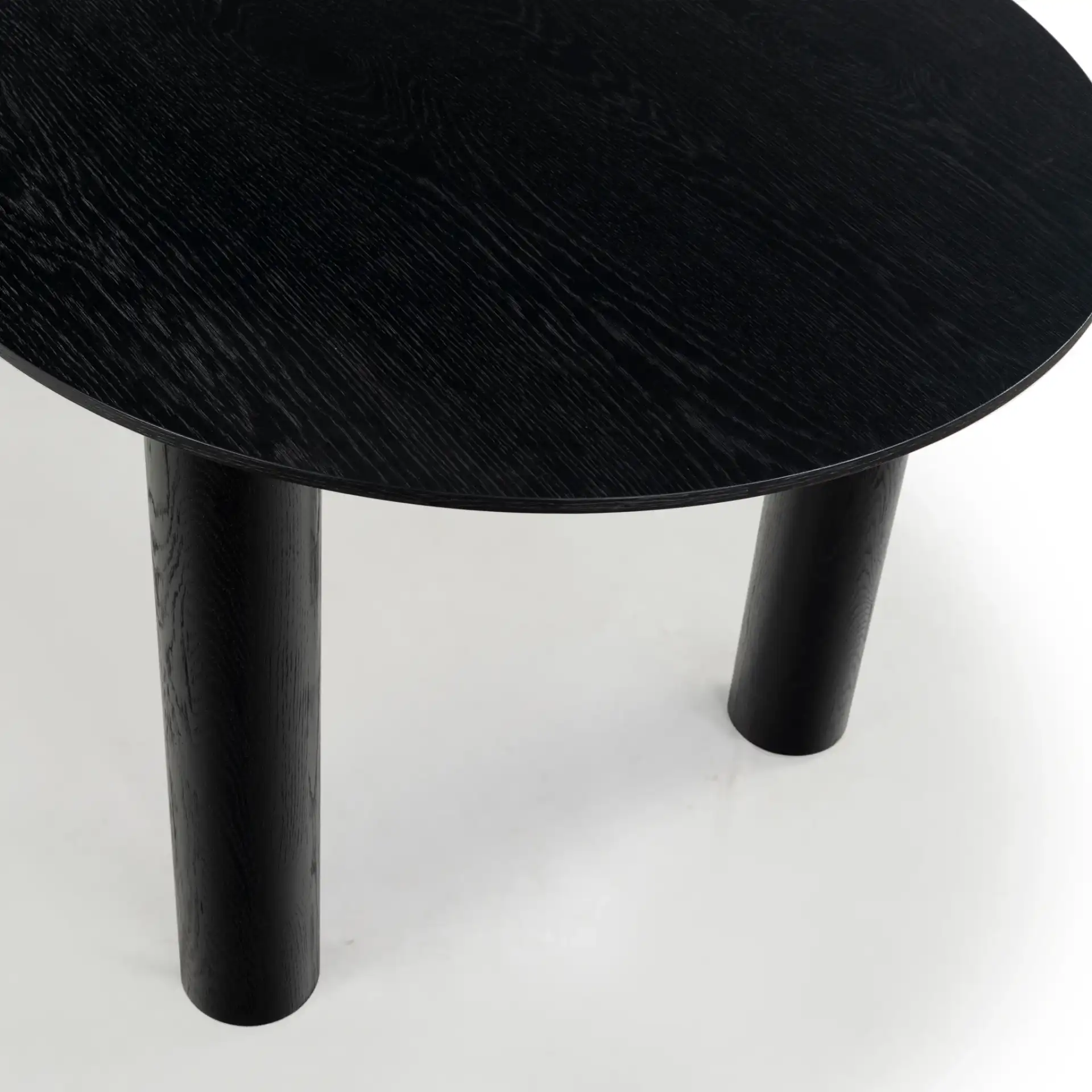 Sofiette Oval Dining Table in Black in a styled room
