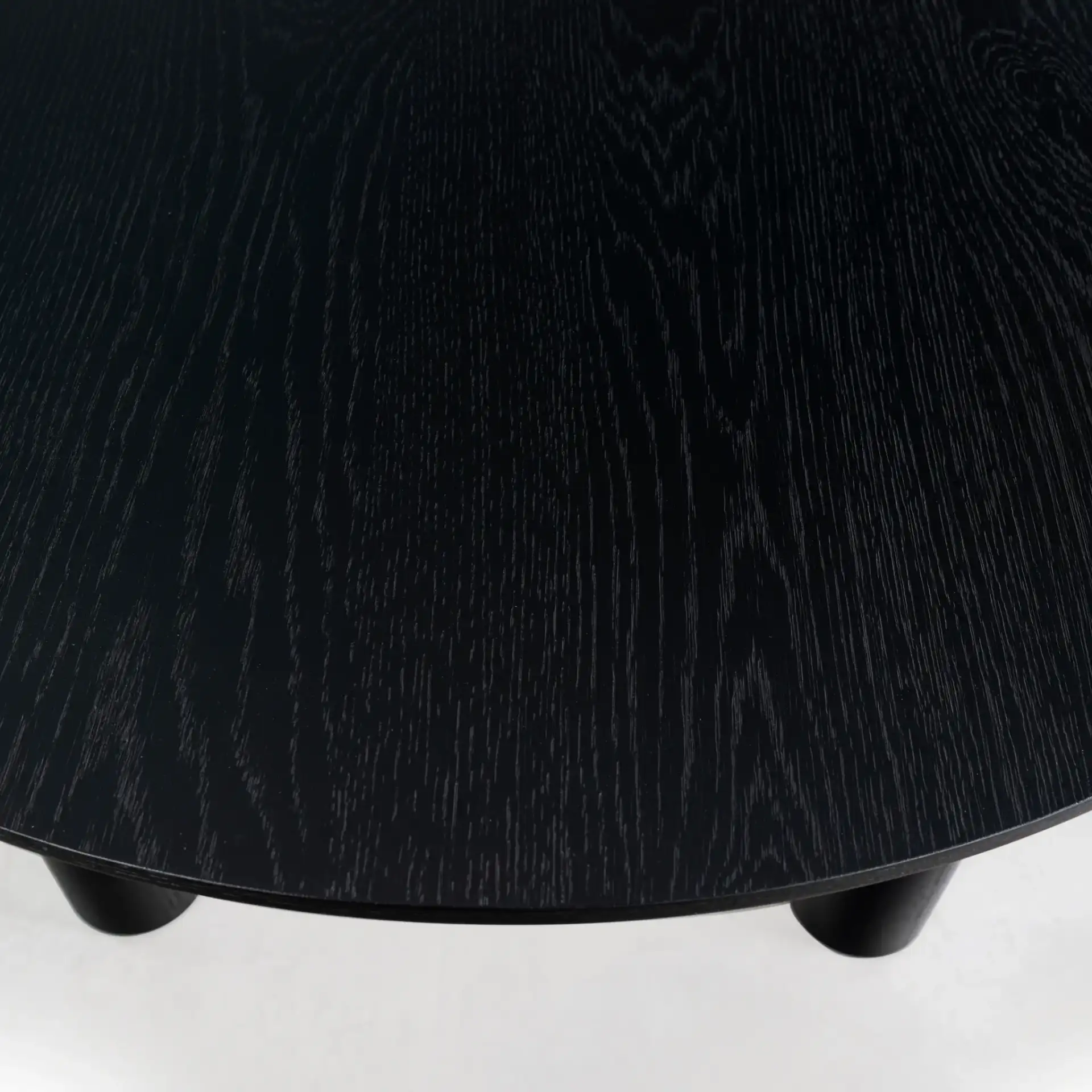 Sofiette Oval Dining Table in Black in a styled room