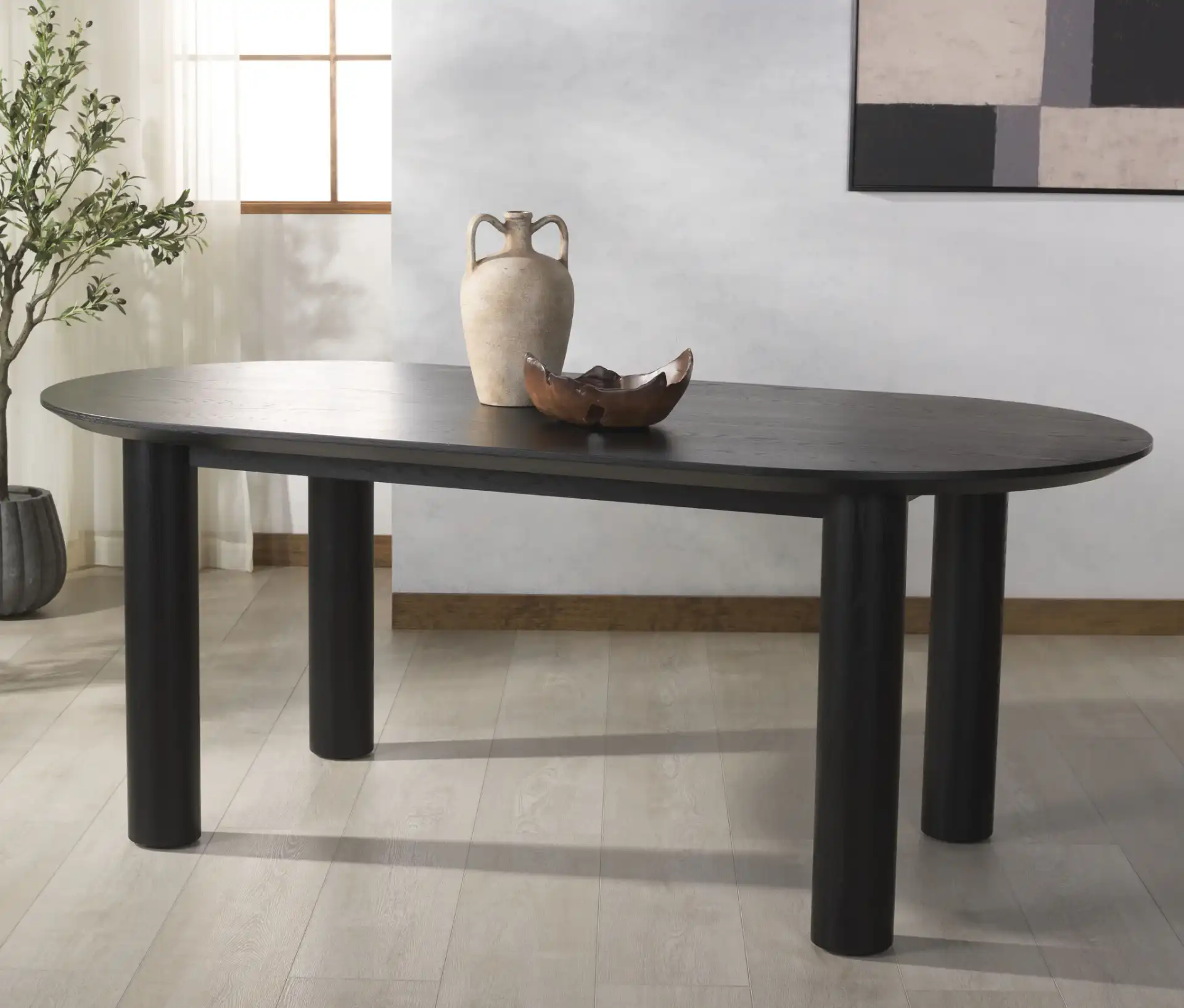 Sofiette Oval Dining Table in Black in a styled room